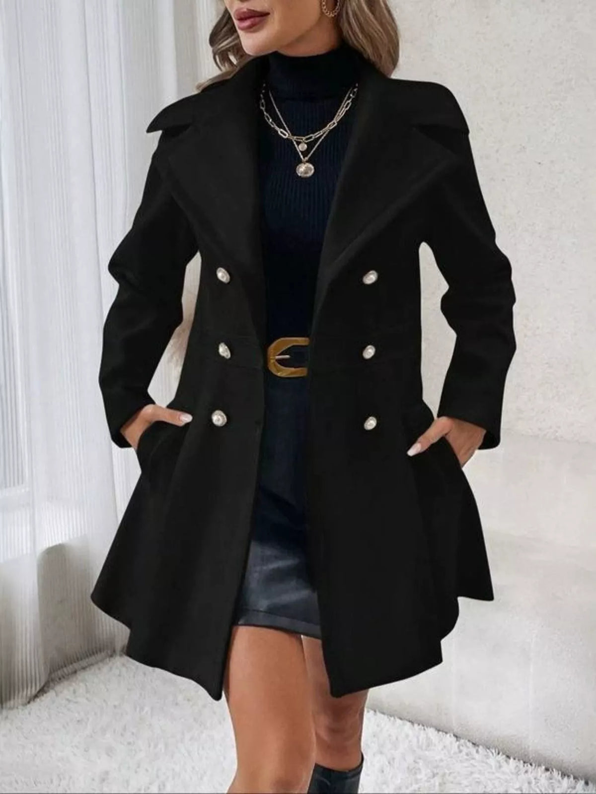Black double-breasted peplum coat, open front view