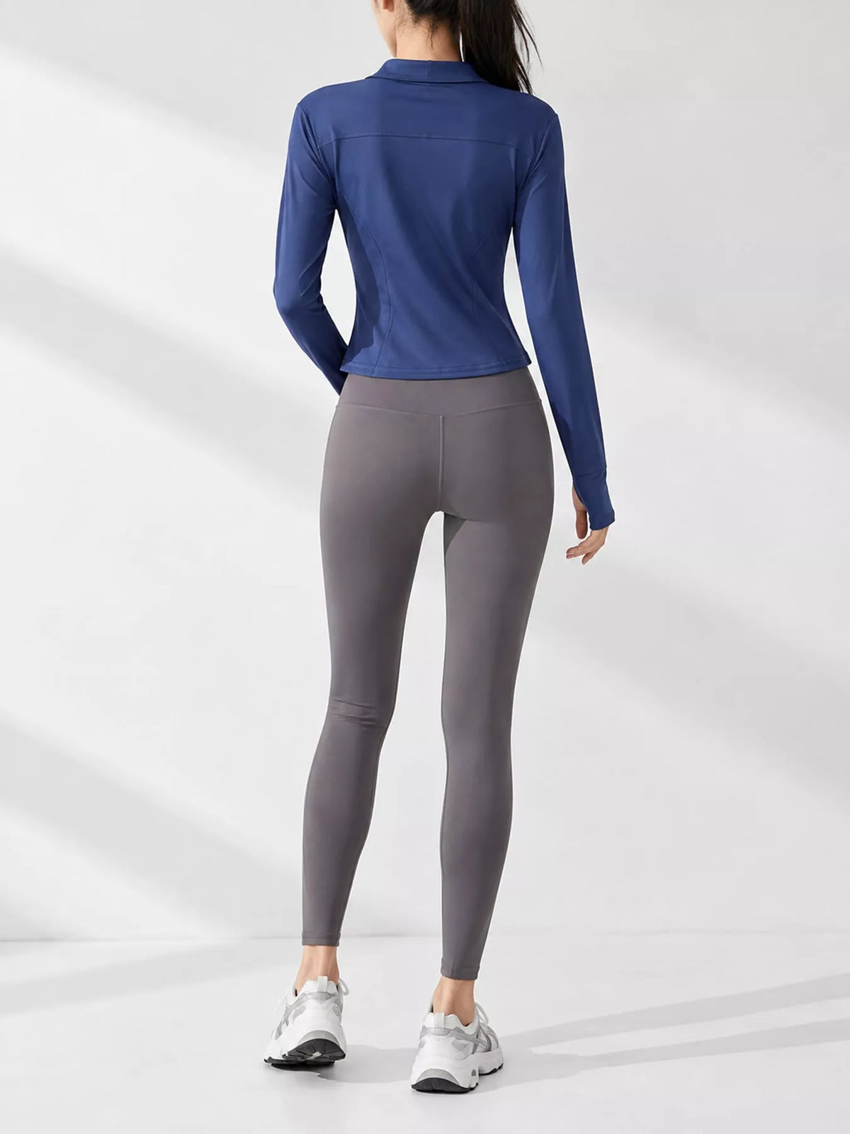Navy quick-dry zip-up jacket, back view