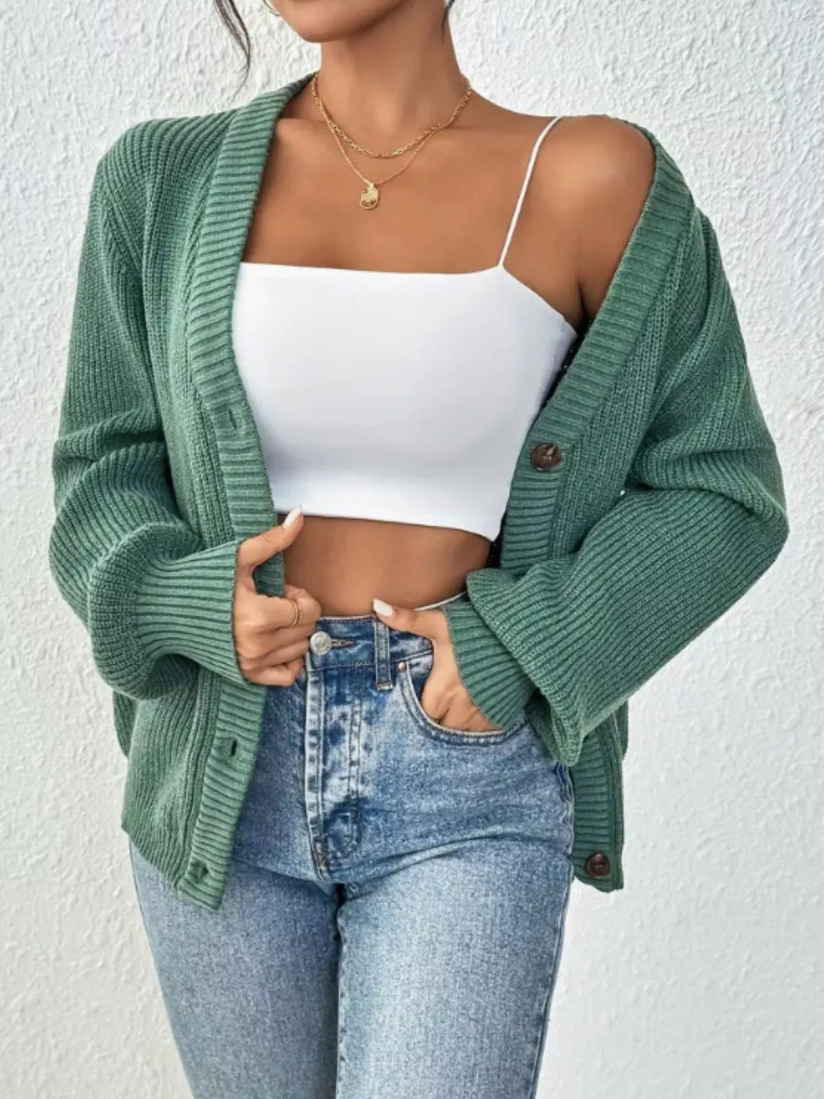 Green v-neck button-front cardigan, front with dropped shoulder styling.