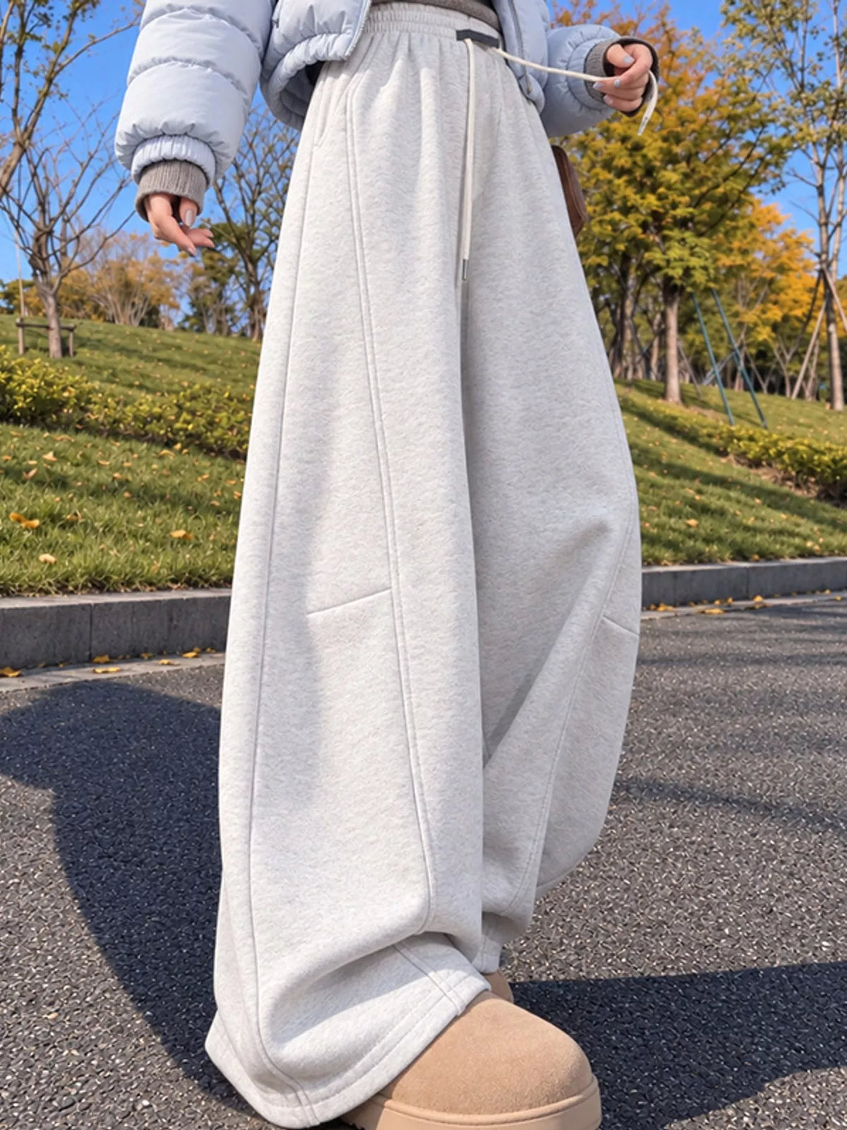 Light gray wide leg drawstring sweatpants, side view