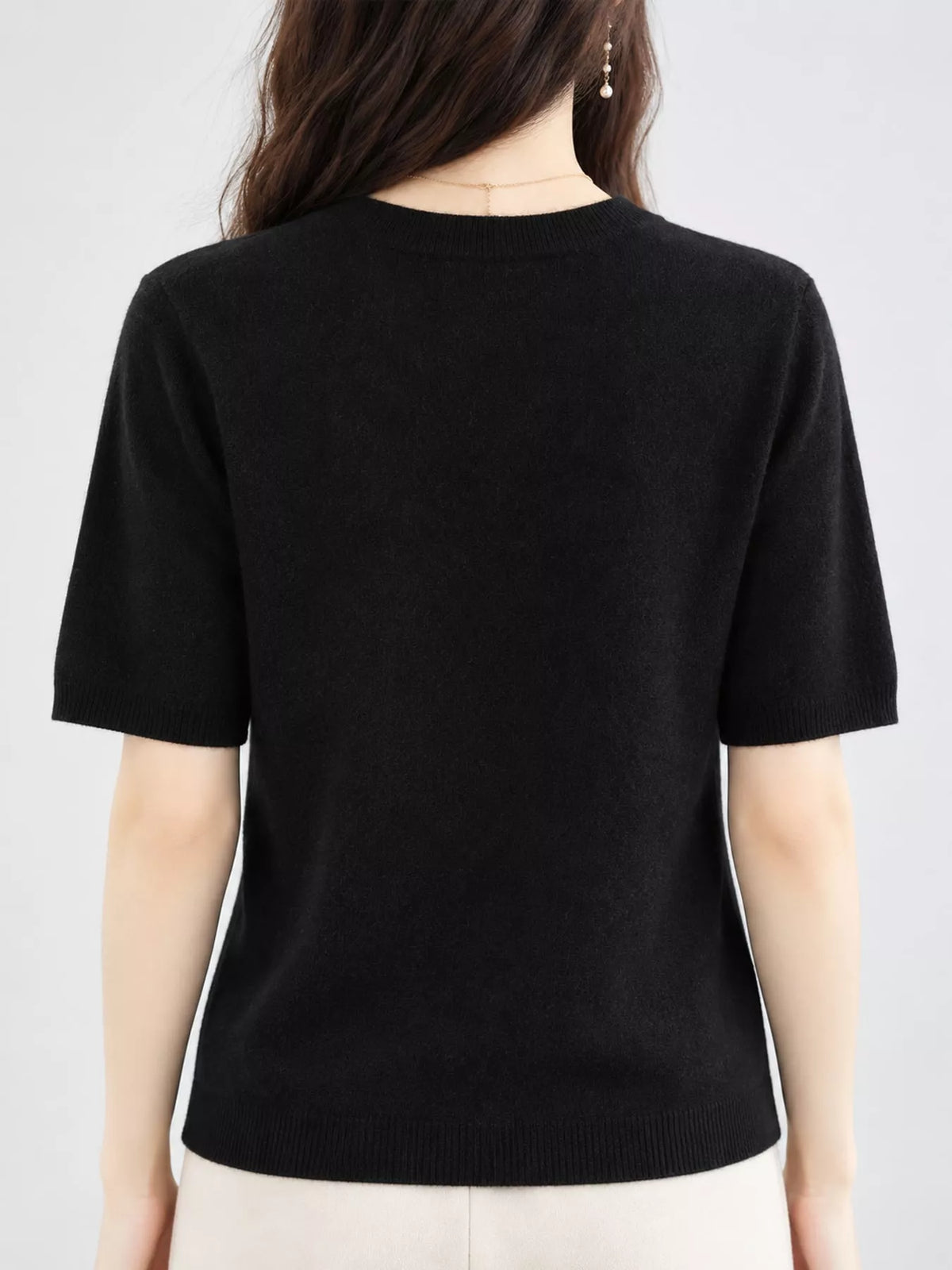 Black round neck short-sleeve sweater, back view
