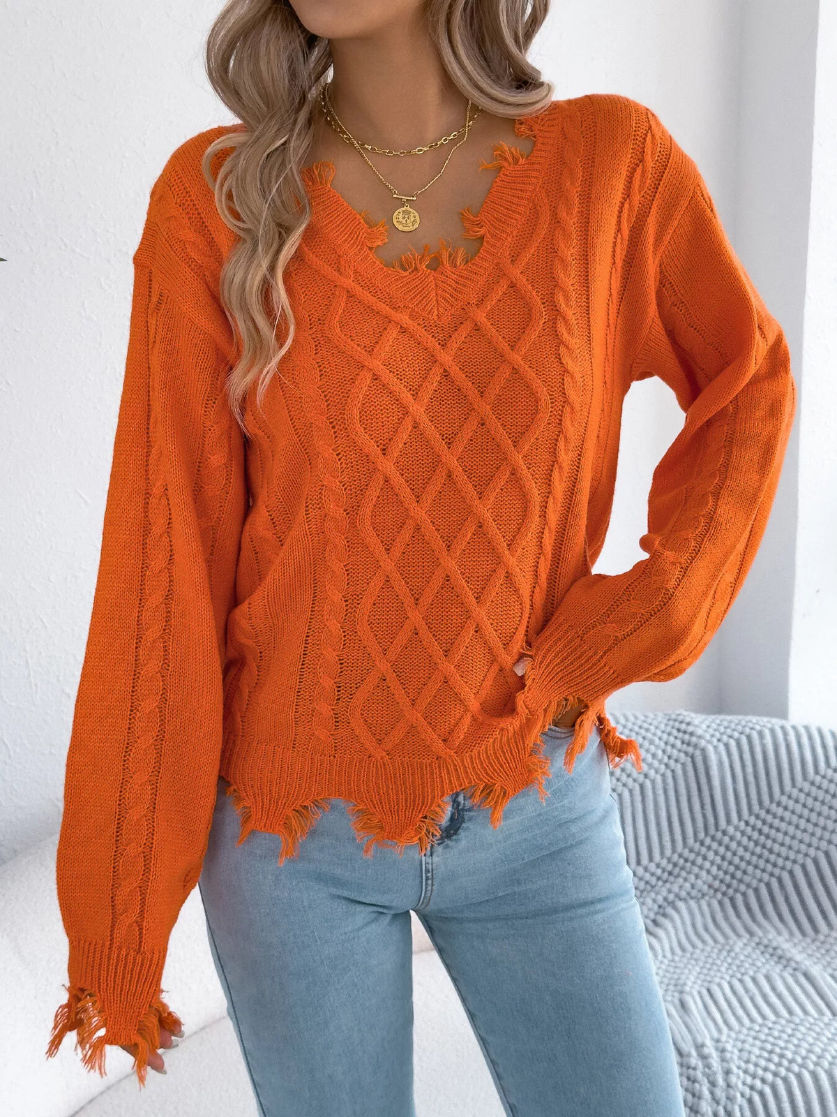 V-Neck Distressed Hem Cable Knit Sweater in orange, front view