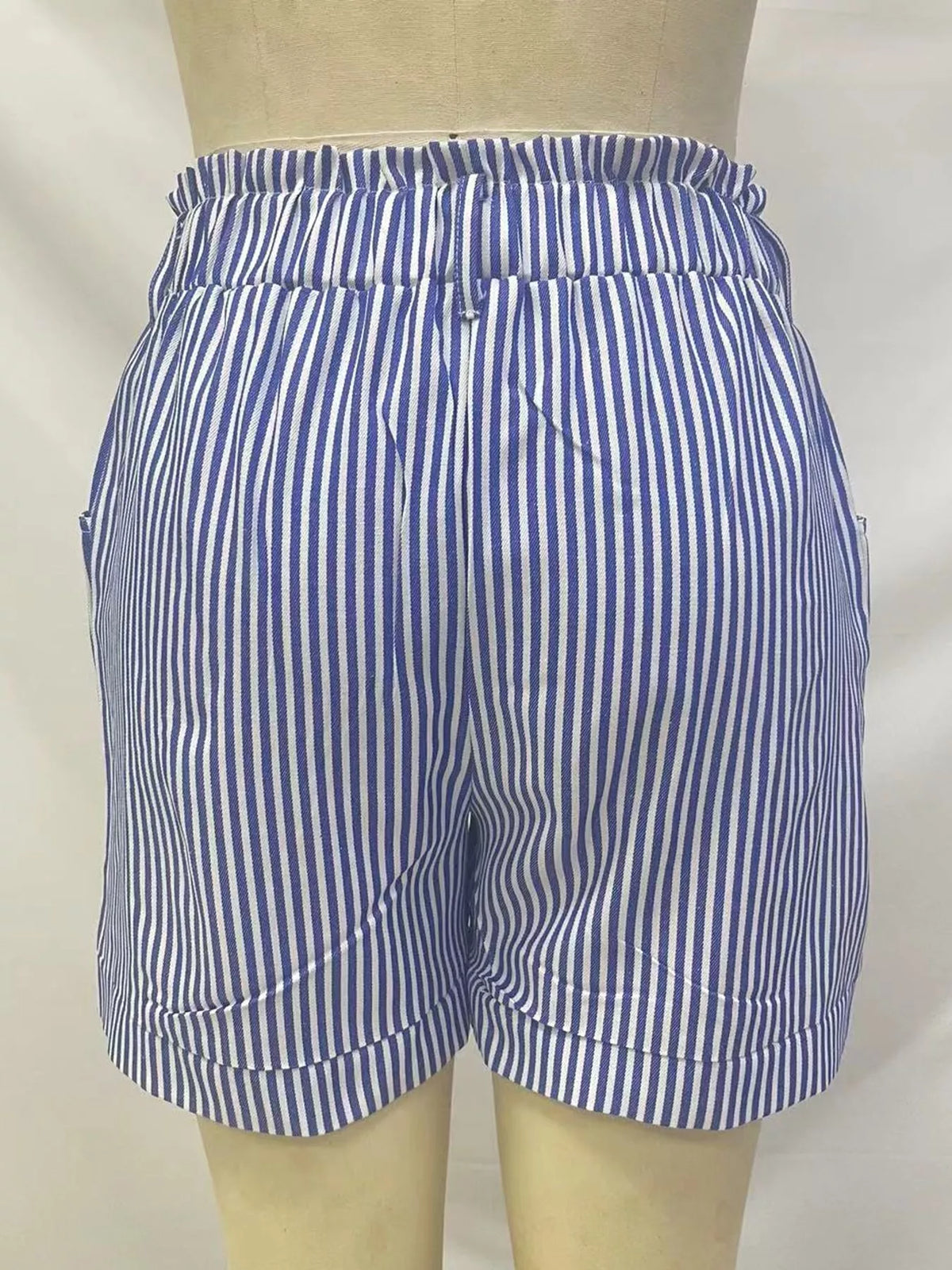 Blue and white high waisted striped shorts, back view