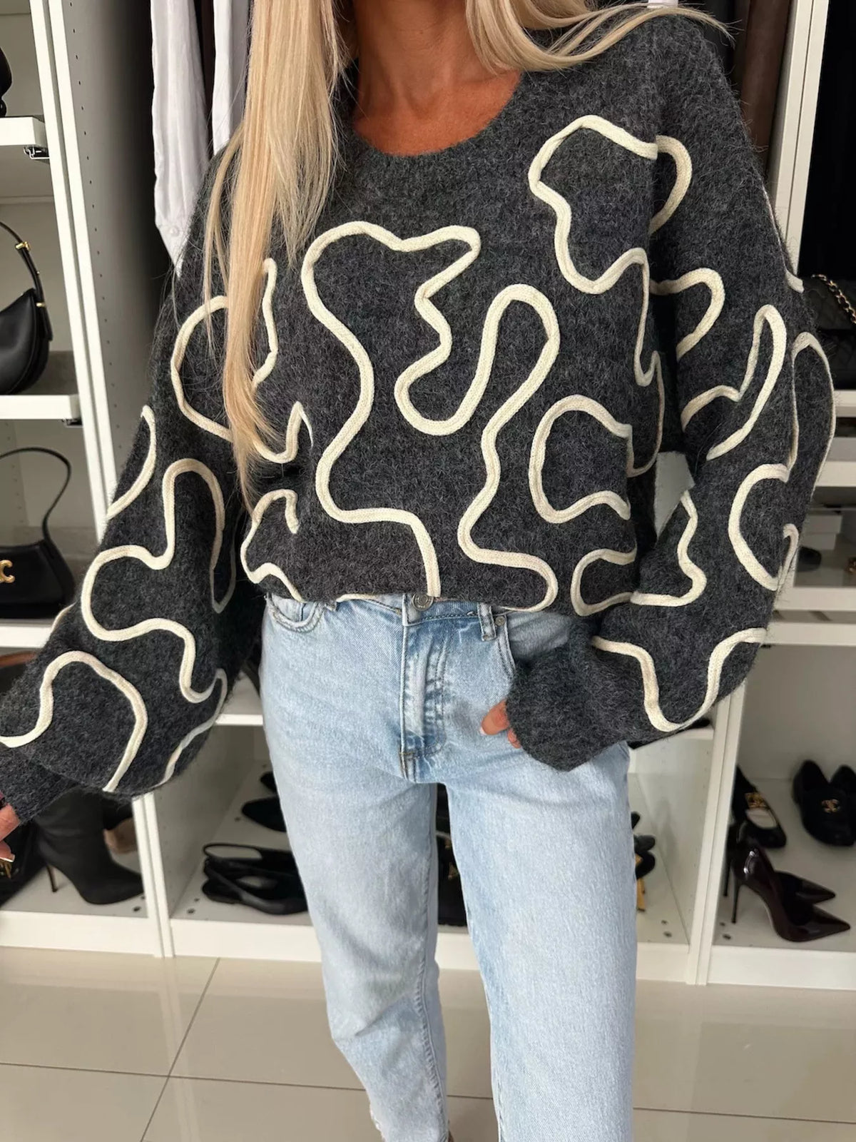 Charcoal abstract pattern oversized crewneck sweater, front pattern detail.