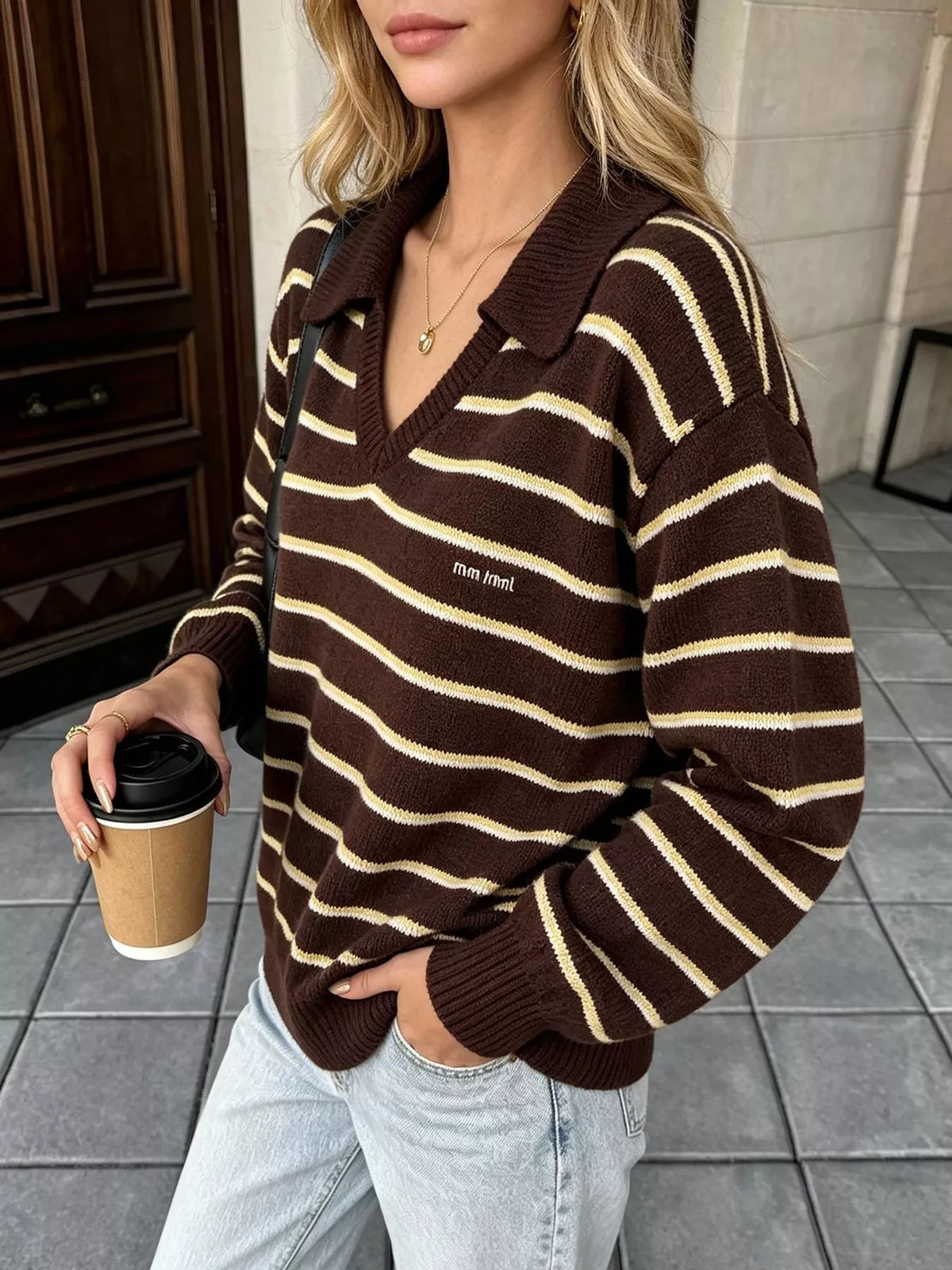 Brown and cream striped polo-collar sweater, angled front view.