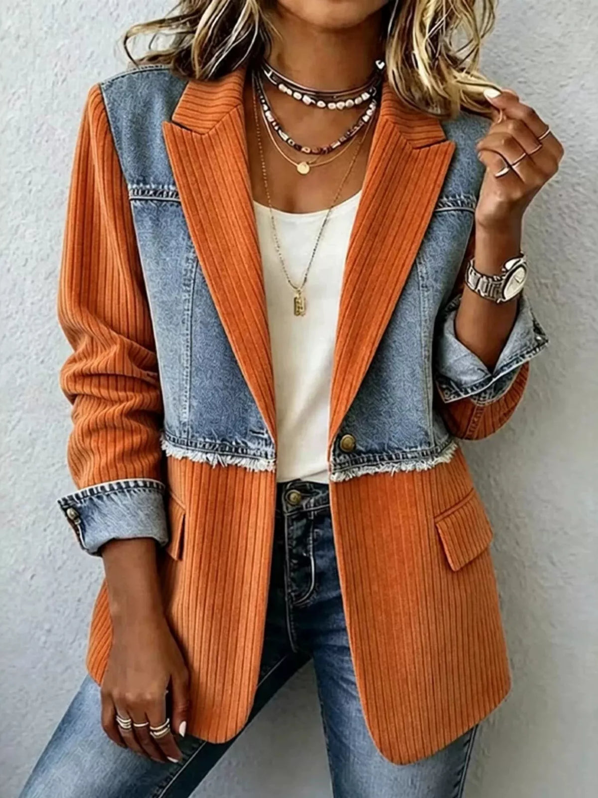 Orange and blue ribbed blazer with contrasting panels, front view
