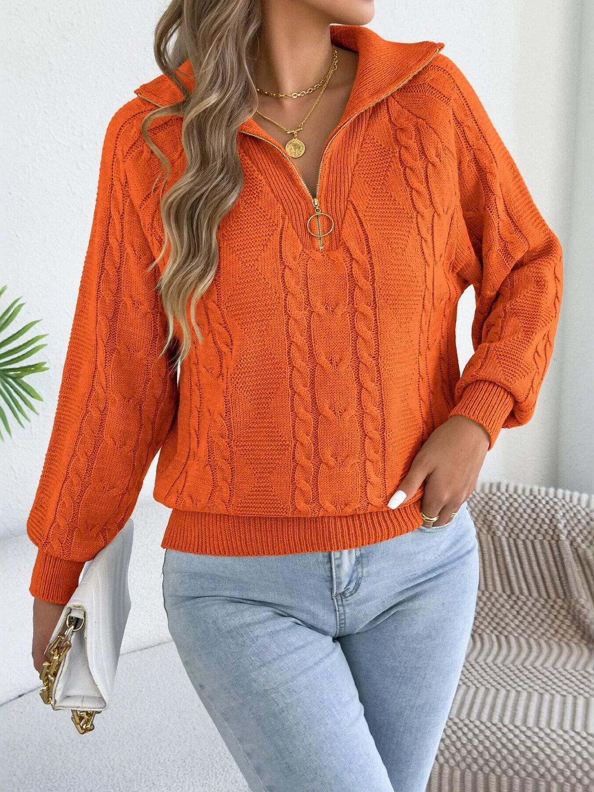 Orange quarter-zip cable knit sweater