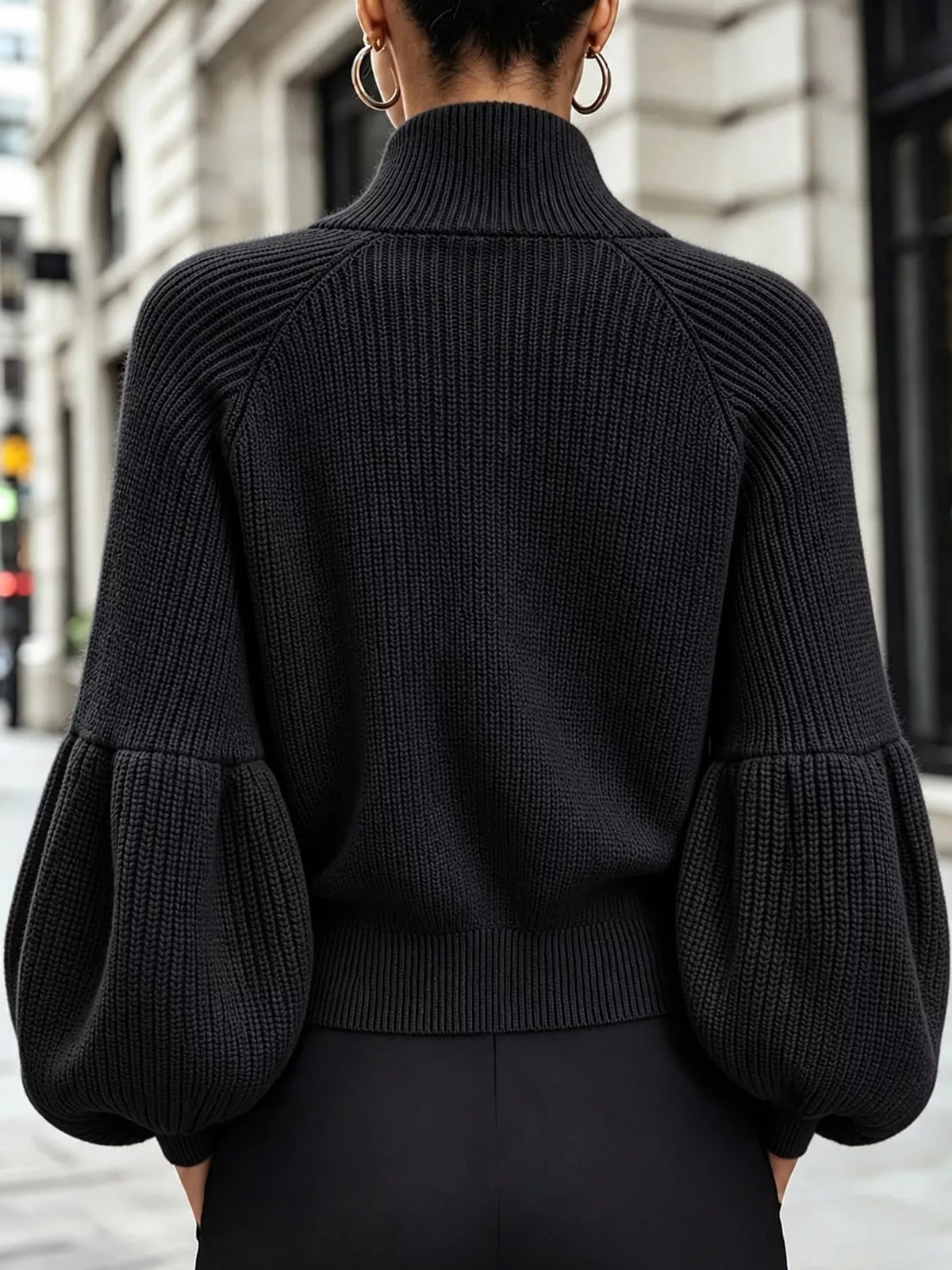 Black ribbed knit zip-up lantern sleeve cardigan, back view