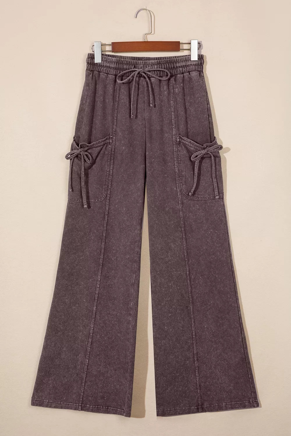 Drawstring cargo pants, hanging front