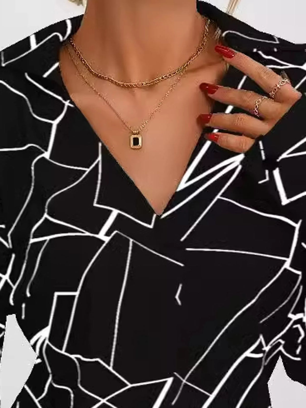 Black geometric print long sleeve blouse