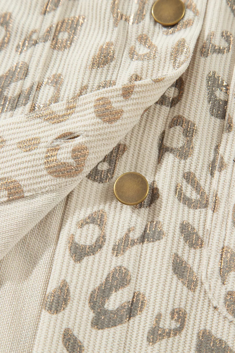 Beige leopard corduroy button-front jacket, button placket and seam detail.
