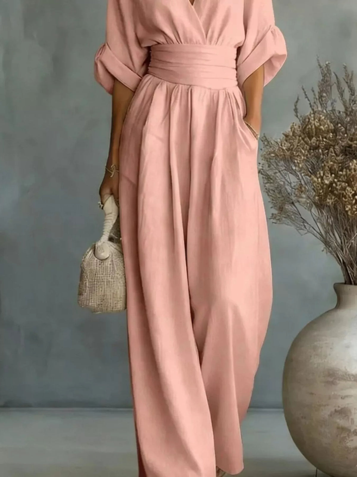 Pink V-neck wide-leg jumpsuit, waist and leg detail