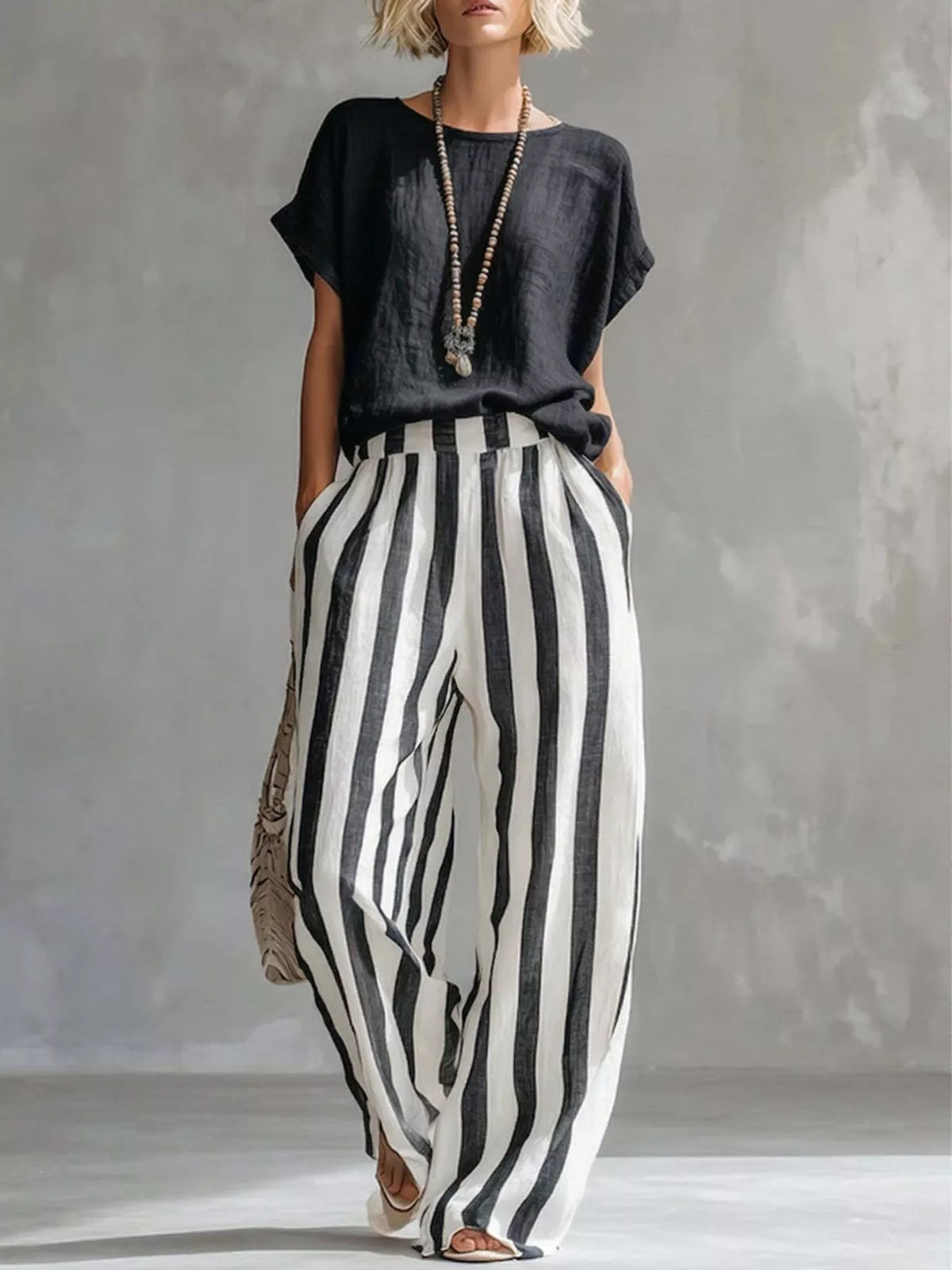Black short sleeve top and wide-leg pants set — front view