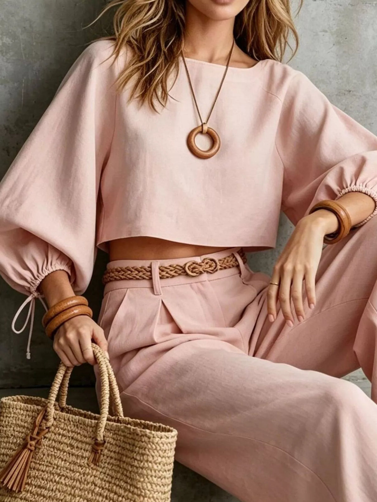 Cropped blouse and pants set, pink seated view