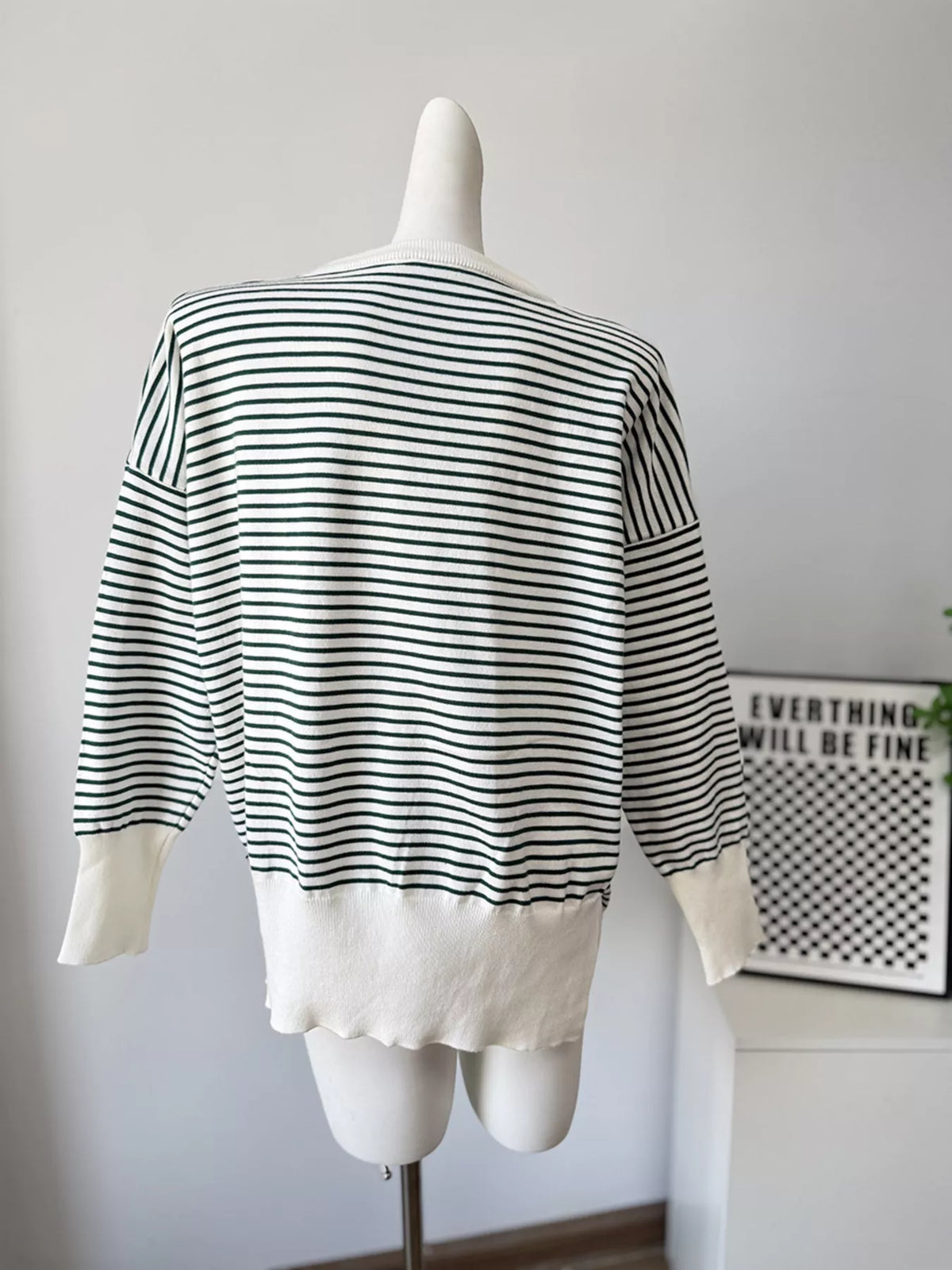 Striped round-neck knit top in white and green, back mannequin view
