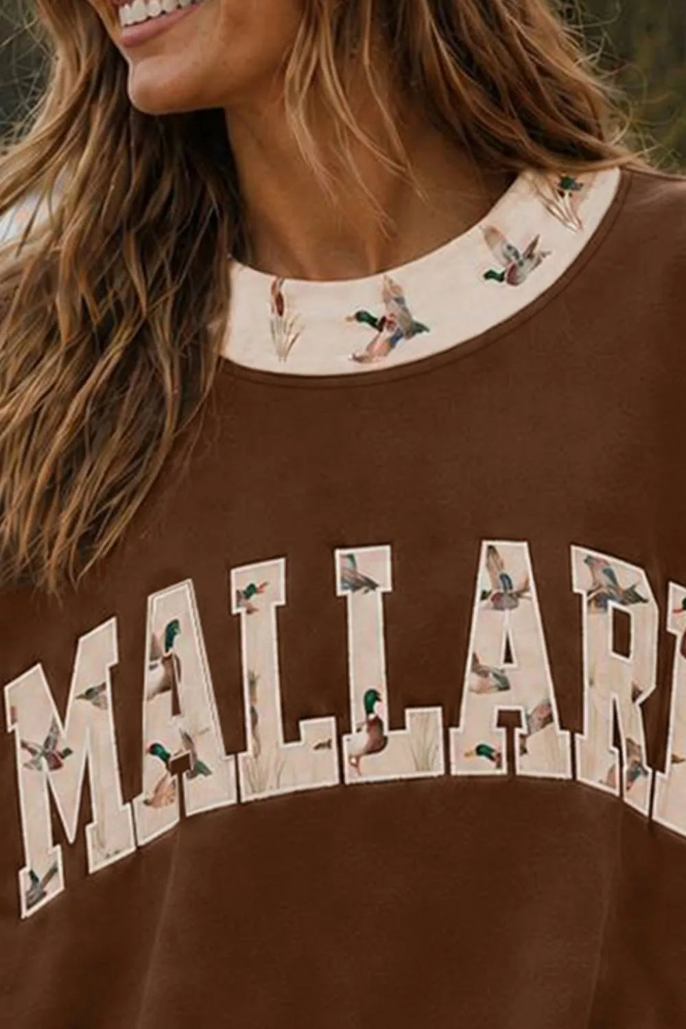 Brown MALLARD graphic sweatshirt, neckline and lettering detail