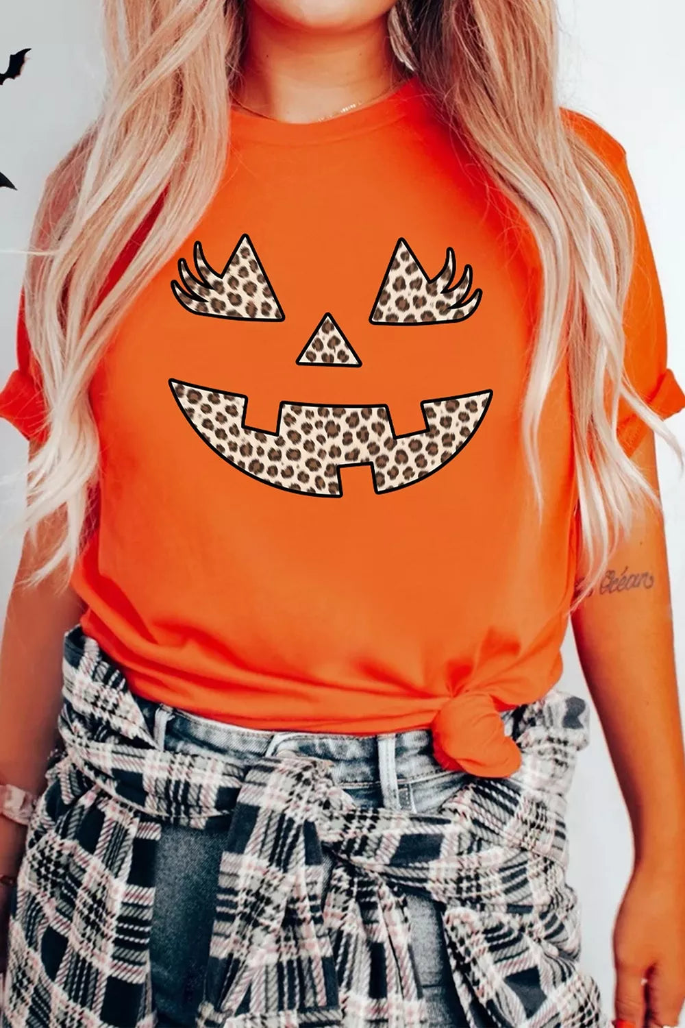 Women's Halloween Pumpkin Face Leopard Graphic T-Shirt in Orange, full-length view