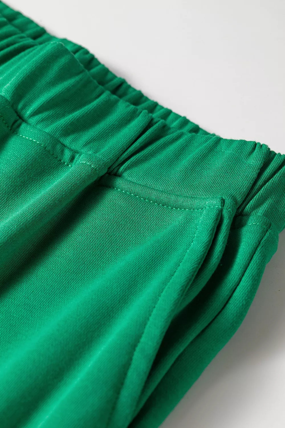 Green hooded top and wide-leg pants set, elastic waistband and pocket detail