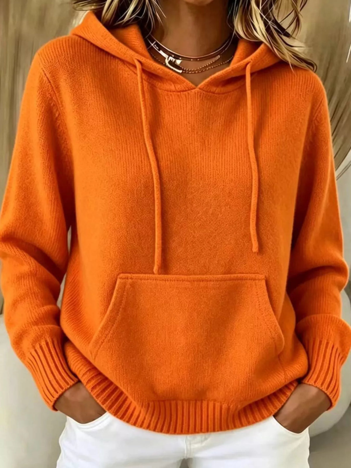 Women's Drawstring Kangaroo Pocket Hooded Sweater in orange — front view