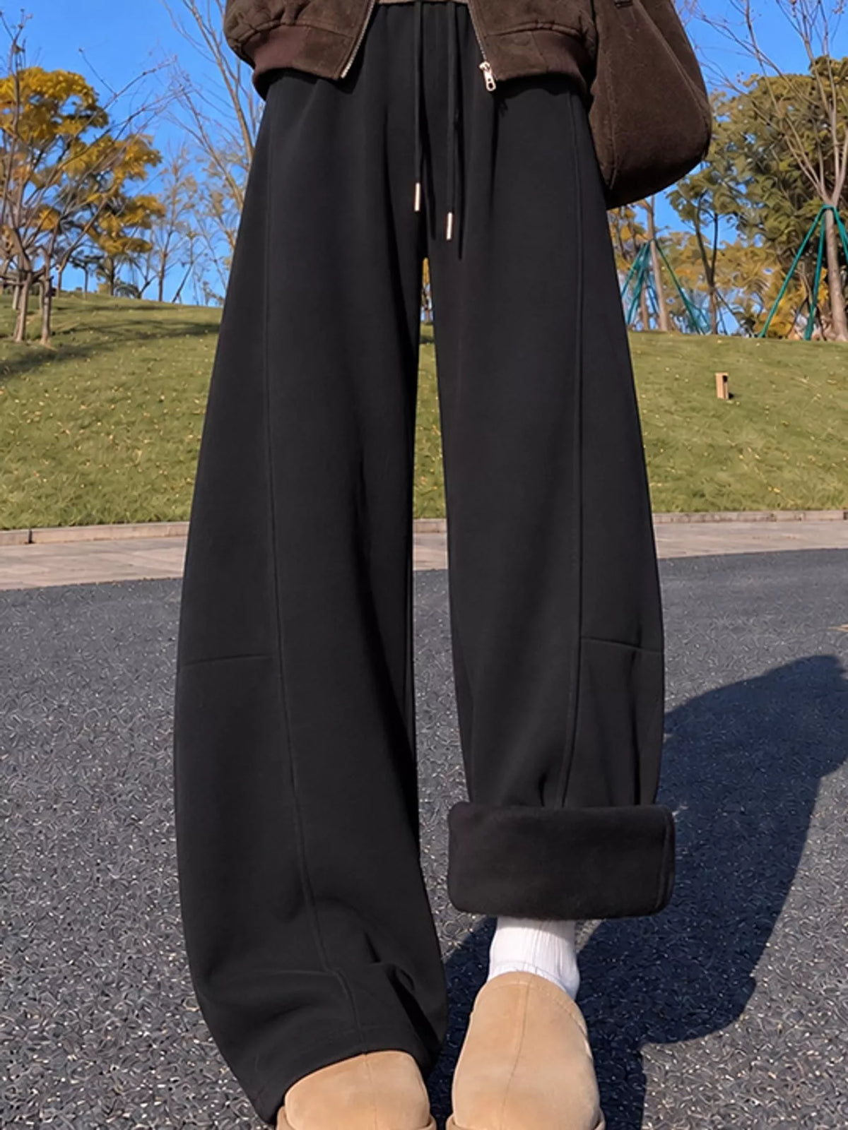 Black wide leg drawstring sweatpants, side view