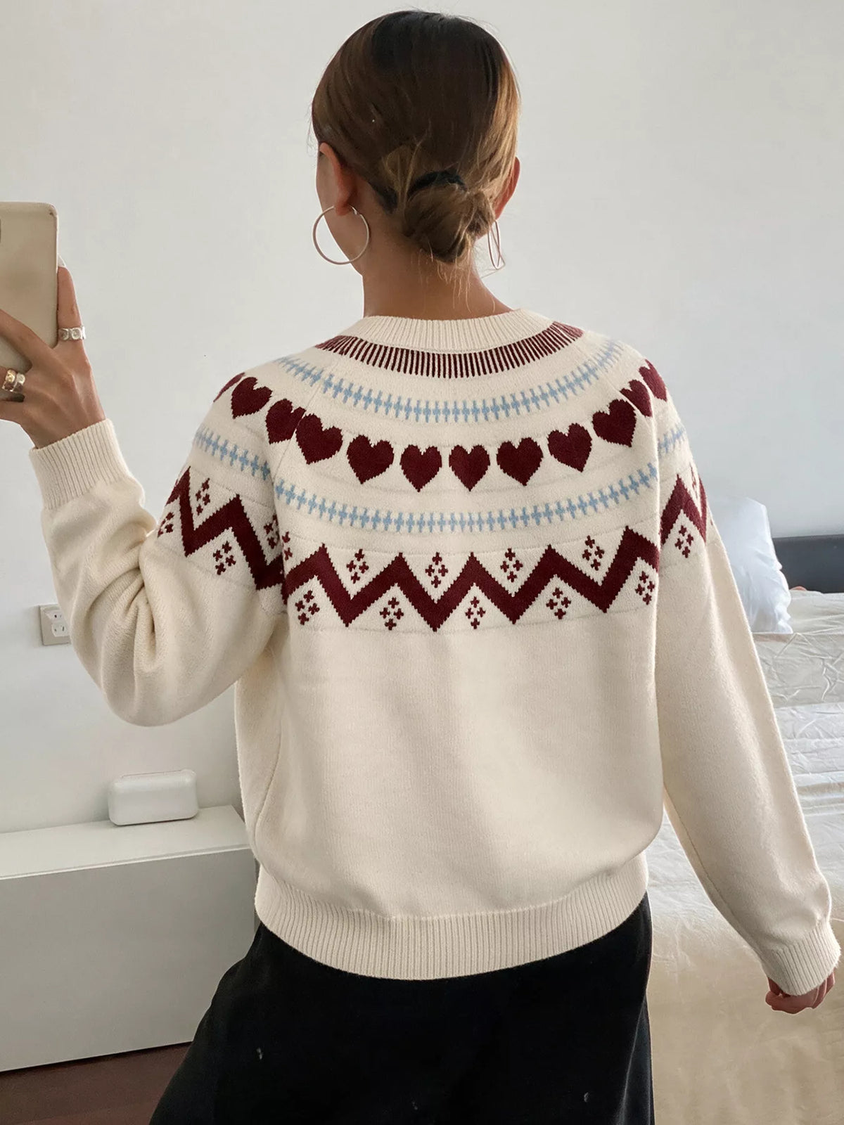 Cream heart-patterned crew neck sweater, back view