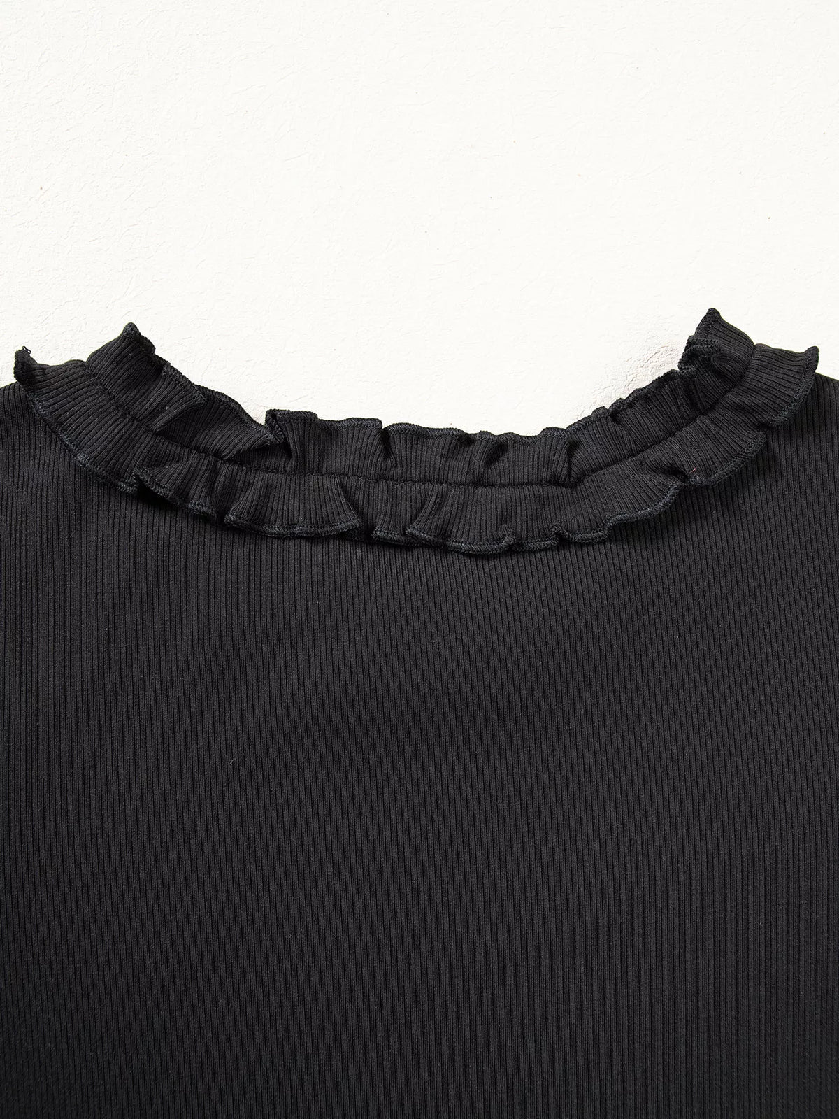 Ruffled back neckline on black round neck frill detail long sleeve top