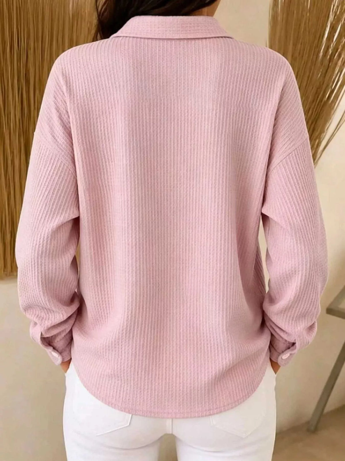 Pink waffle knit snap-front blouse, back view