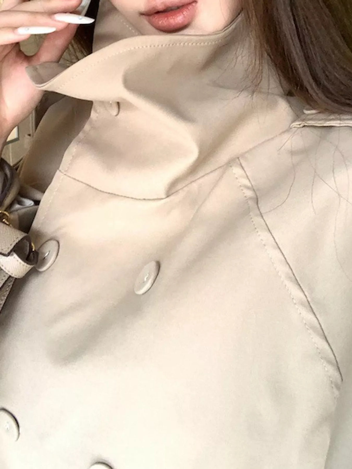 Khaki double-breasted trench jacket with stand collar, detail view