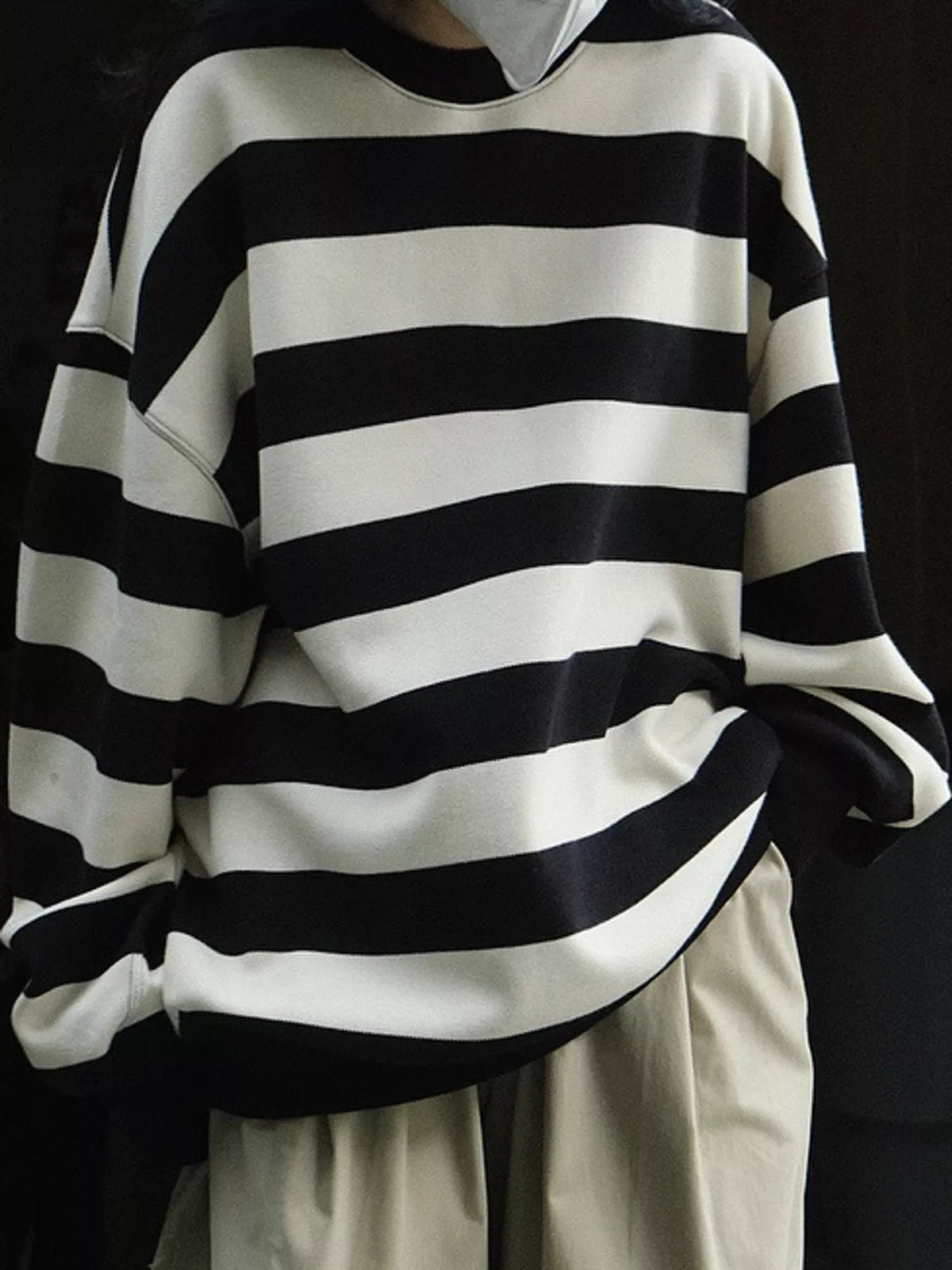 Black oversized striped crewneck sweatshirt, back view