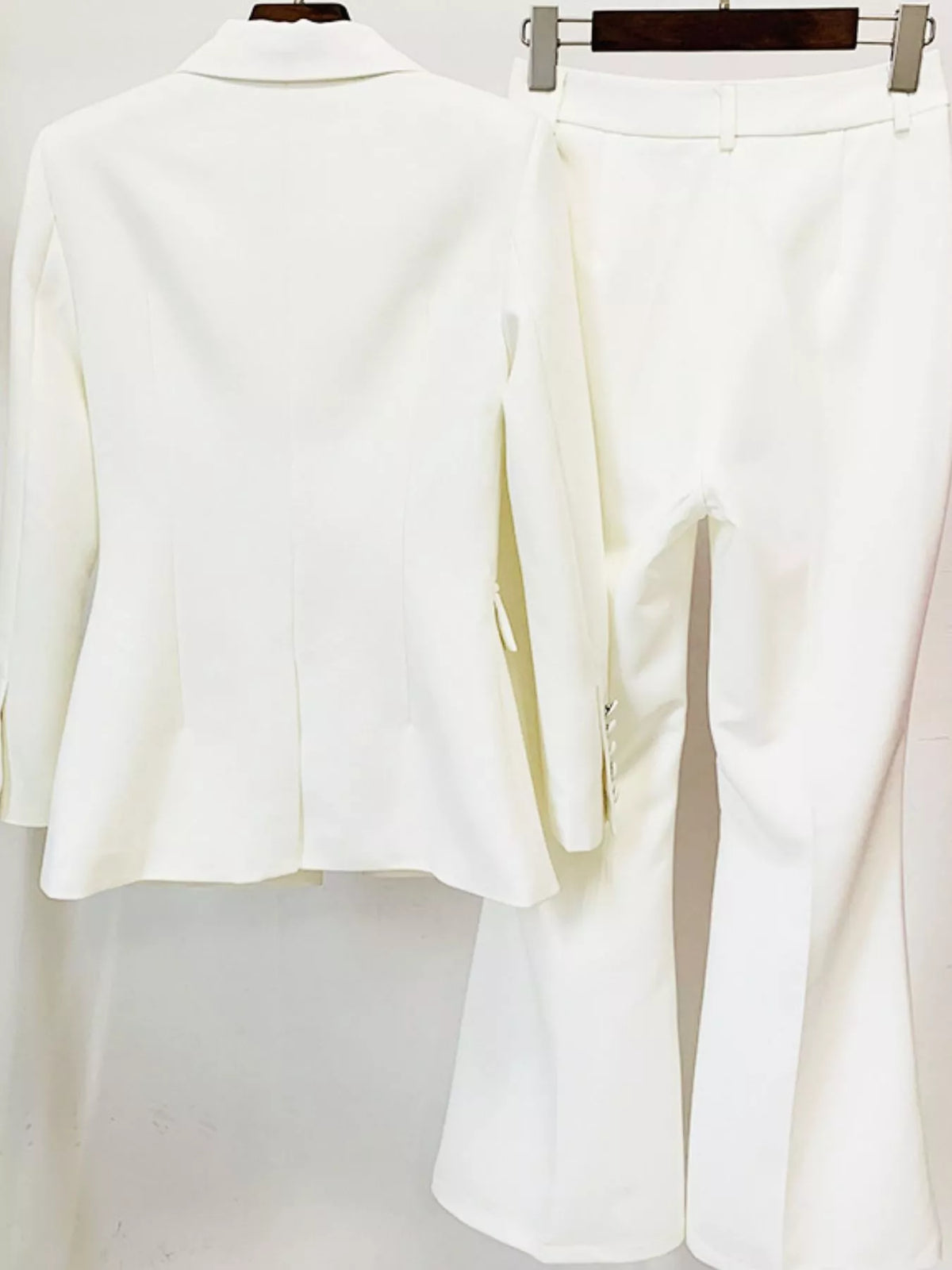 White one-button blazer and flared pants set, detail view