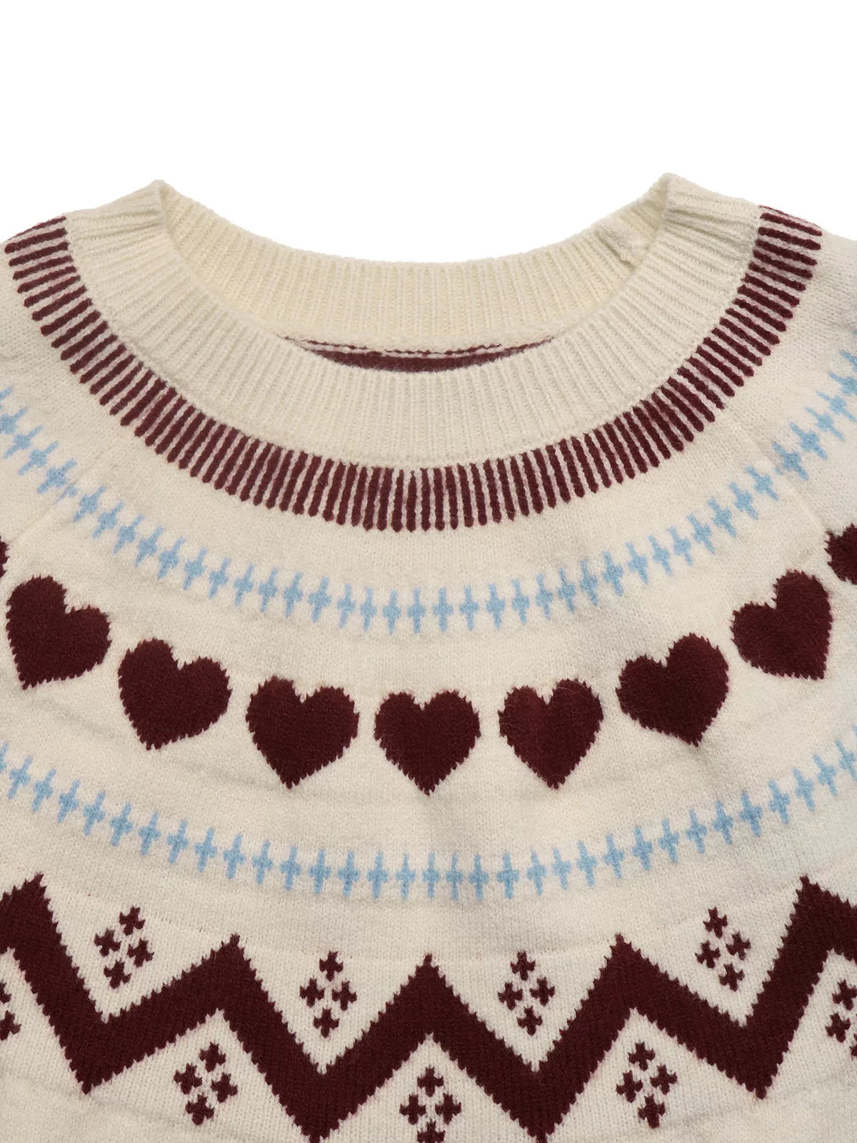 Cream heart-patterned crew neck sweater, neckline detail