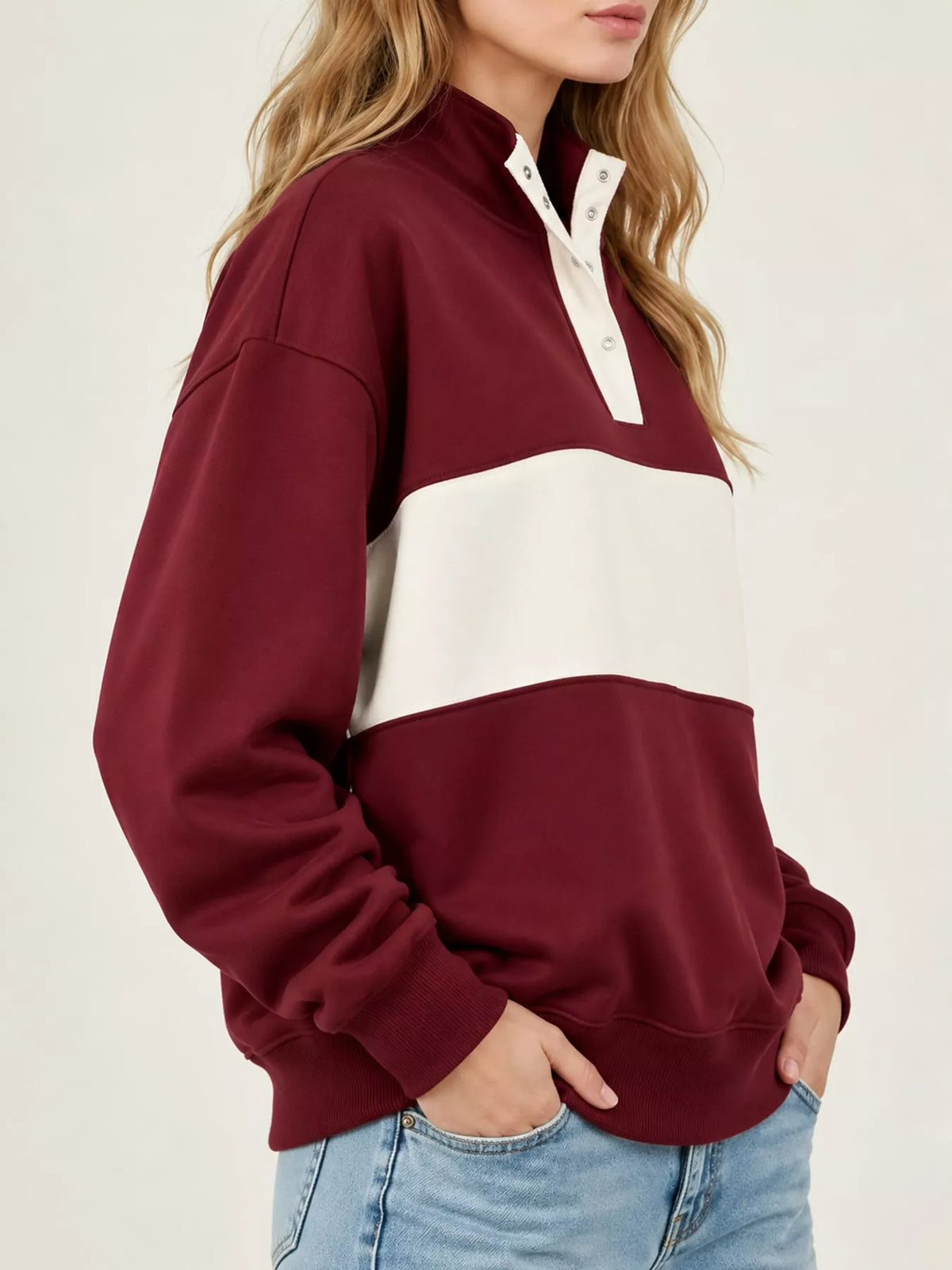 Burgundy and cream color block snap-button sweatshirt, side view