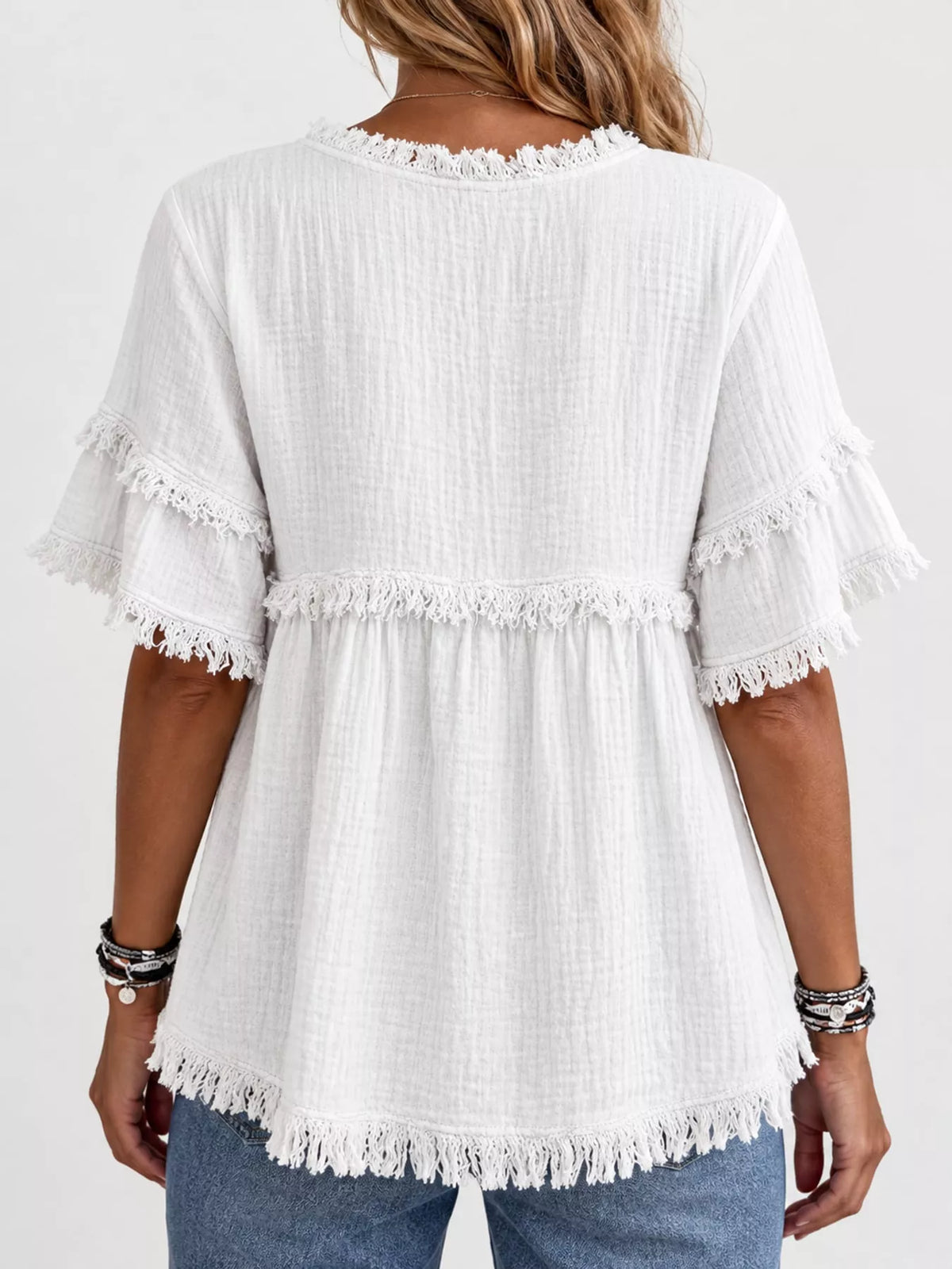 White frayed edge textured blouse, back view