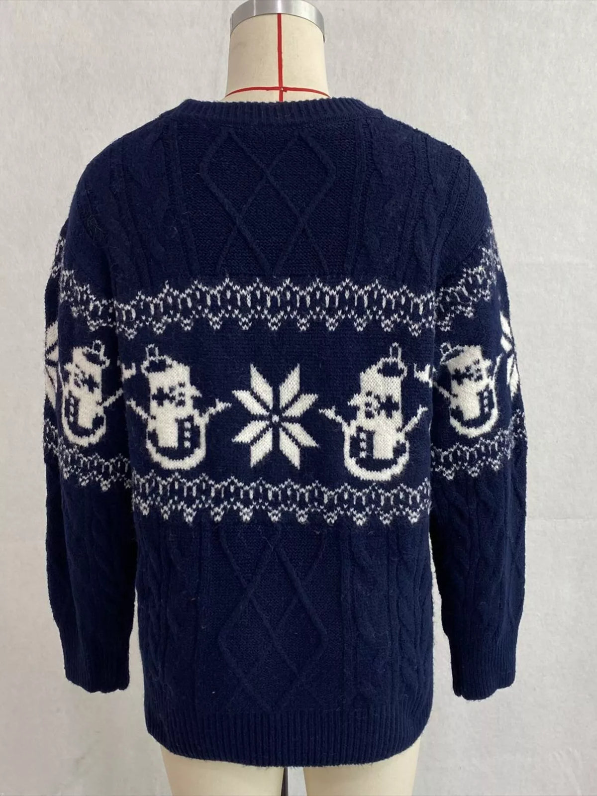 Navy christmas snowman cable-knit sweater, back on dress form.