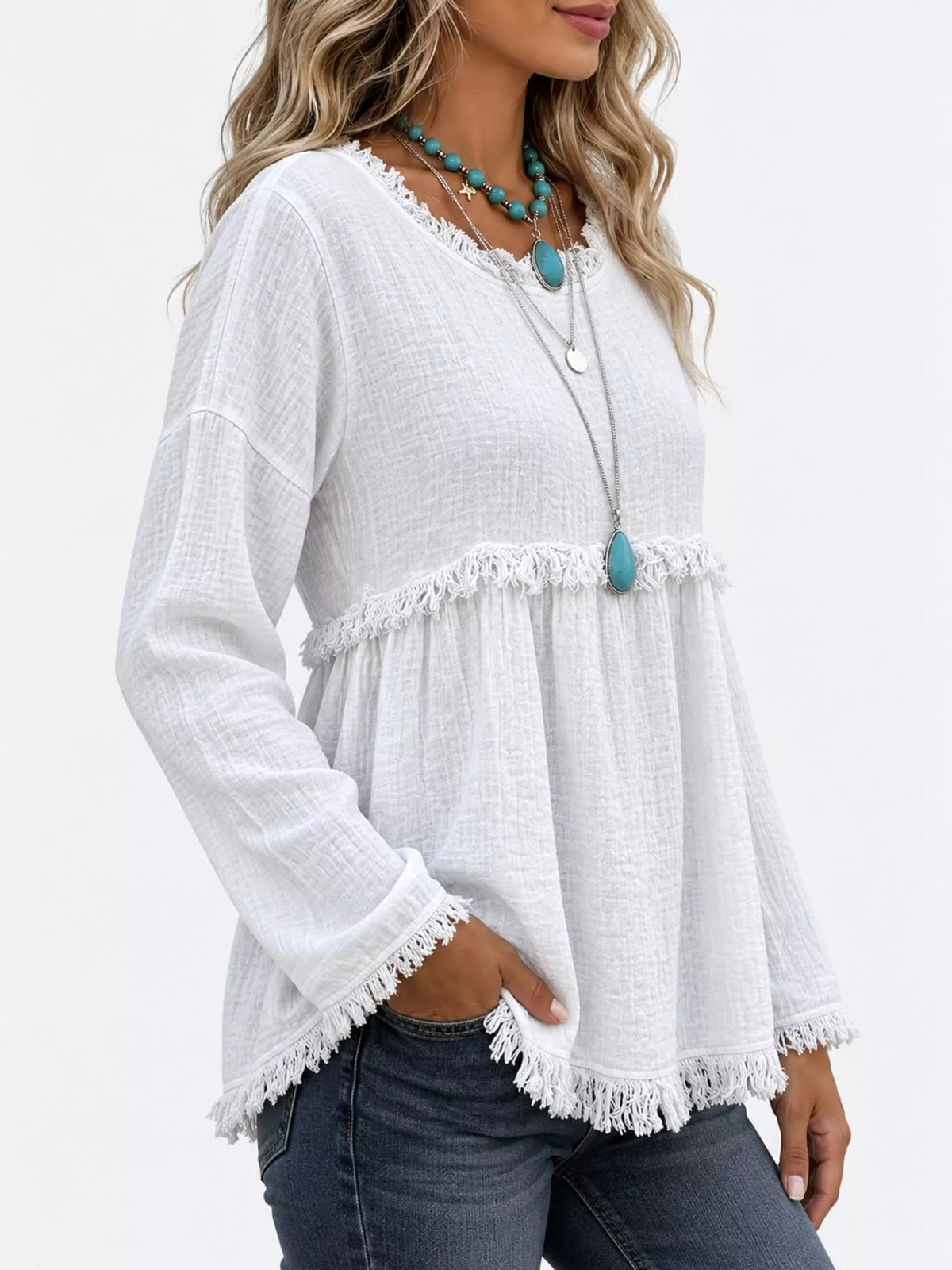 White frayed hem textured blouse, side view