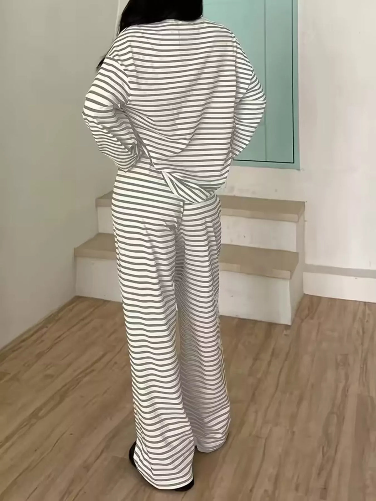 Gray striped long-sleeve top and pants set, back view