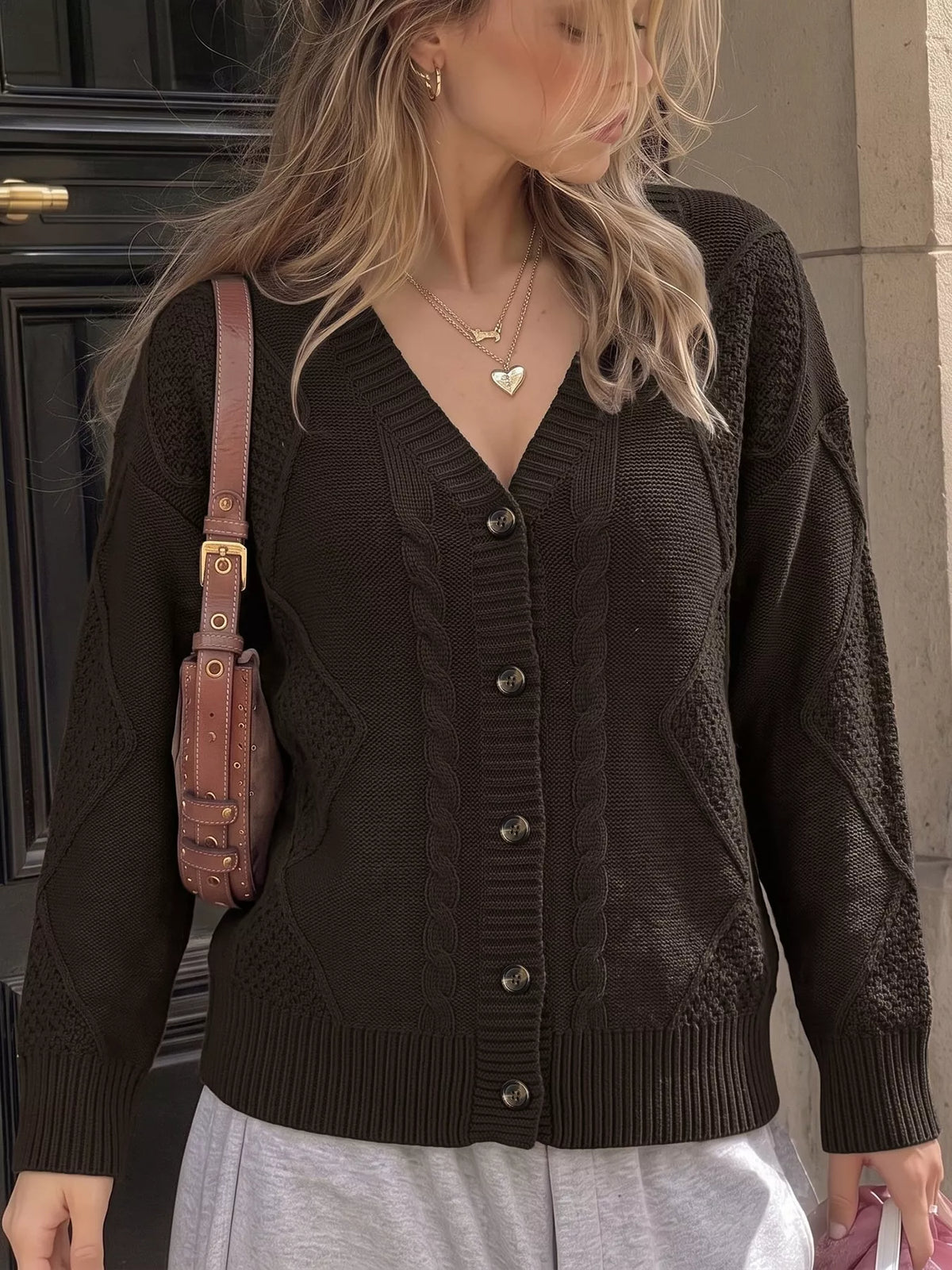 Brown V-neck cable knit cardigan, cable pattern detail