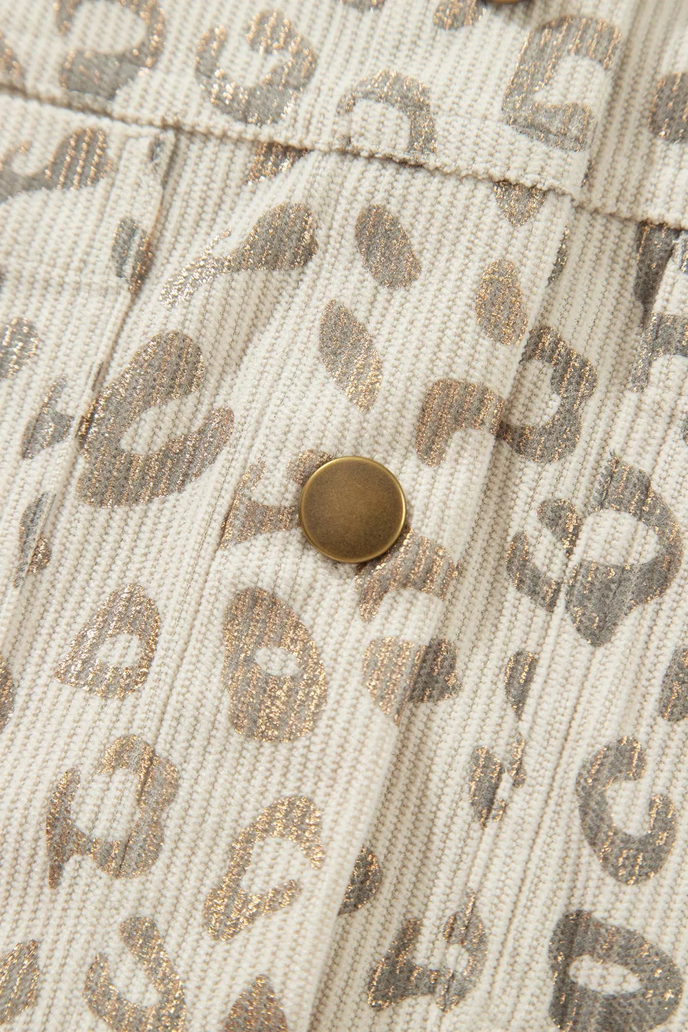 Beige leopard corduroy button-front jacket, button and corduroy texture detail.