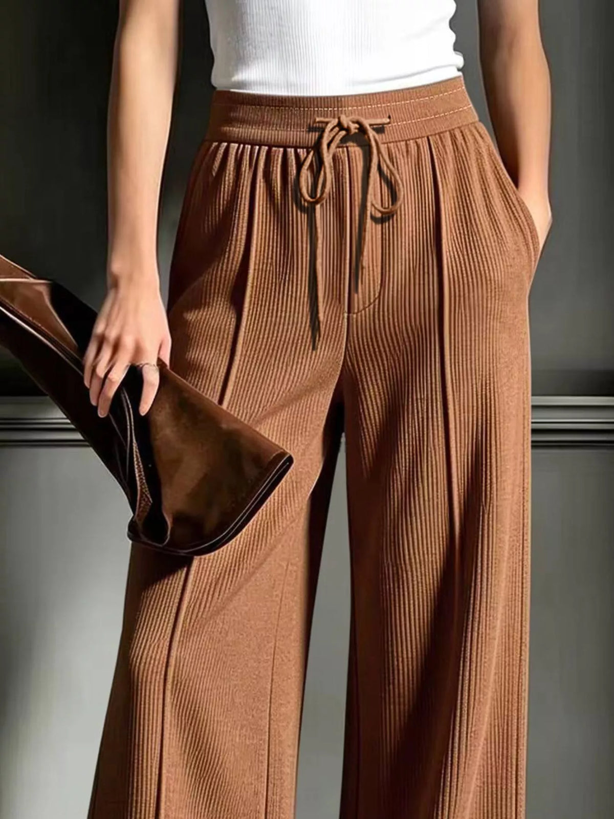 Brown wide-leg ribbed corduroy pants, drawstring waistband and side pockets