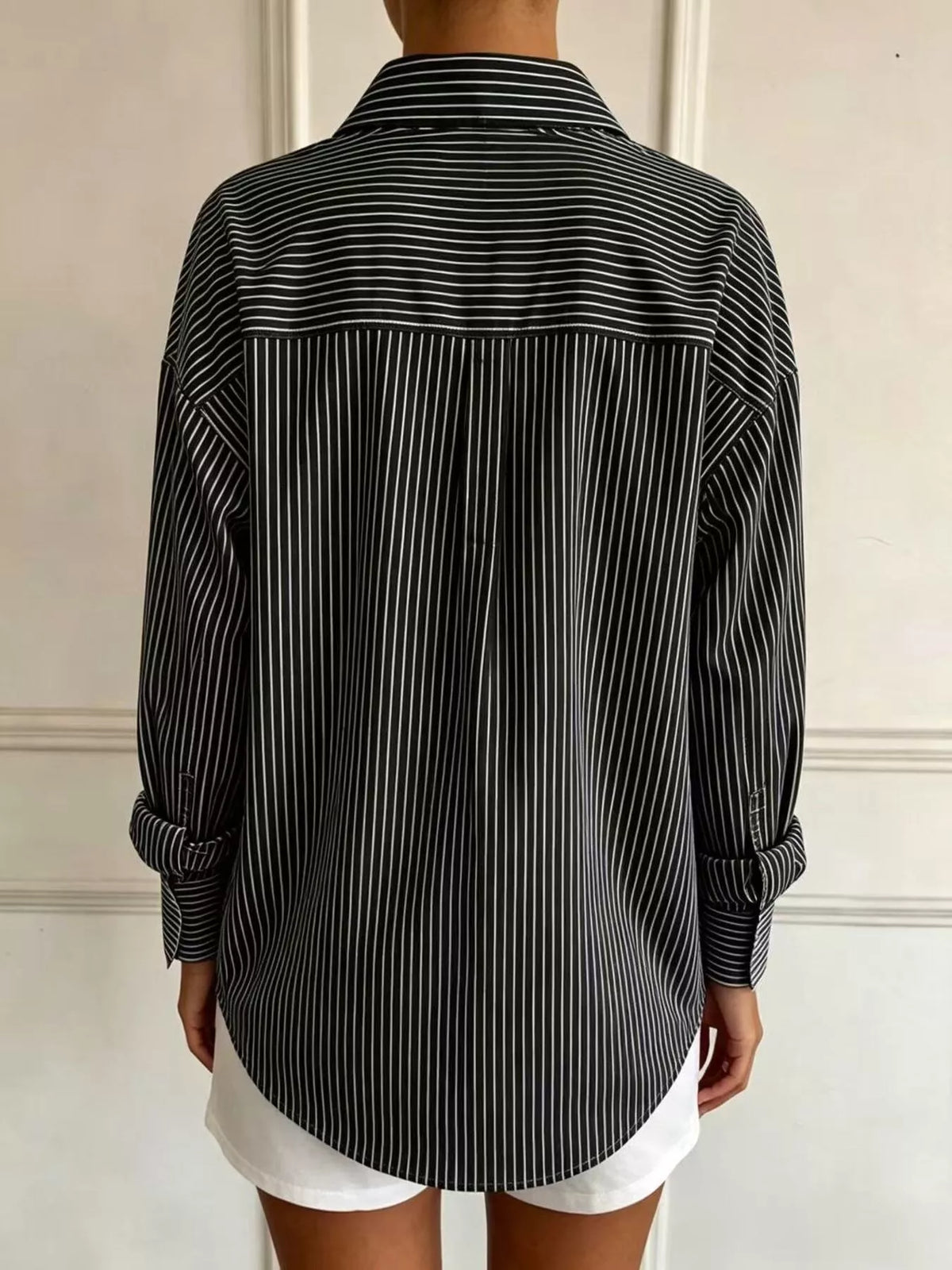 Black striped long sleeve shirt, back view