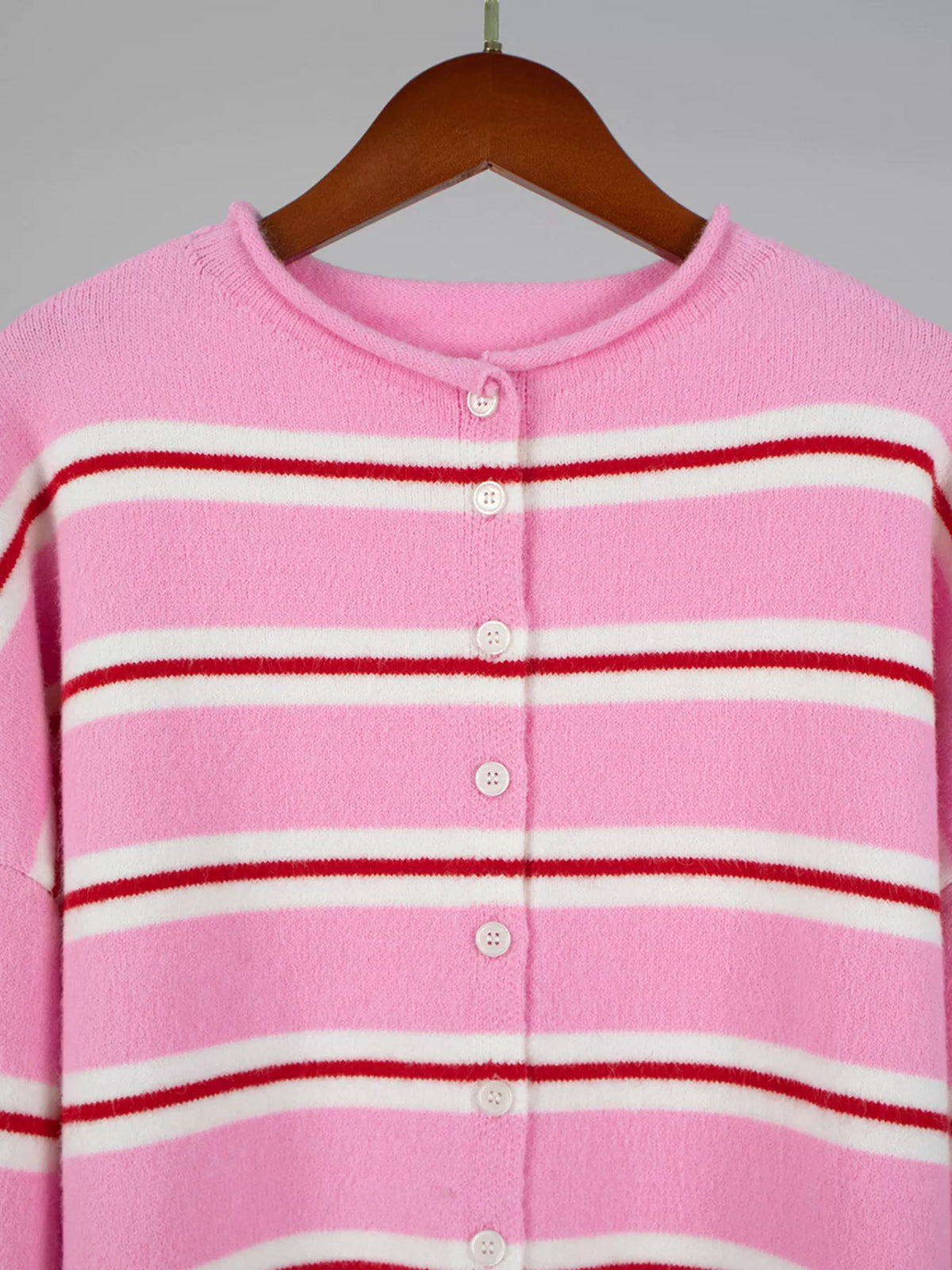 Pink striped button-front cardigan, neckline and button detail