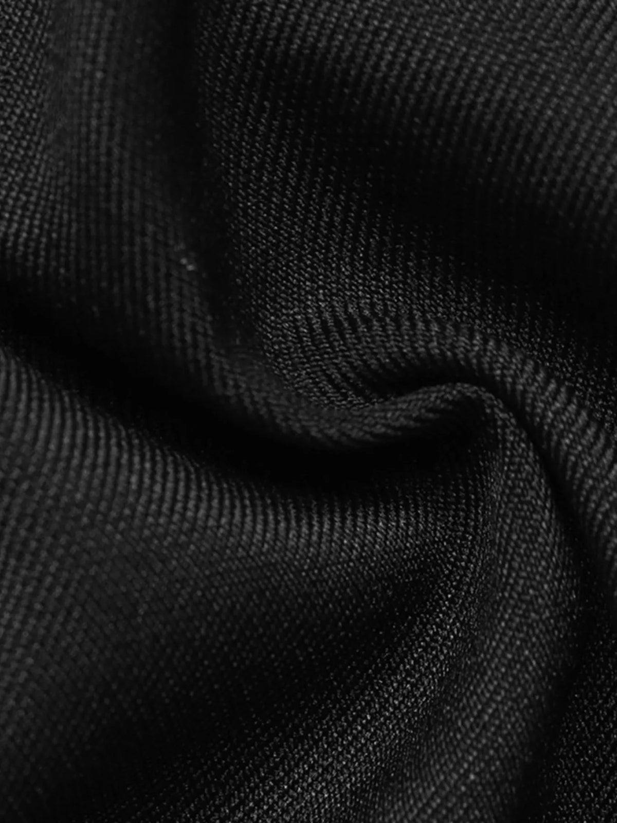 Black wide-leg pants with overlap front, fabric close-up
