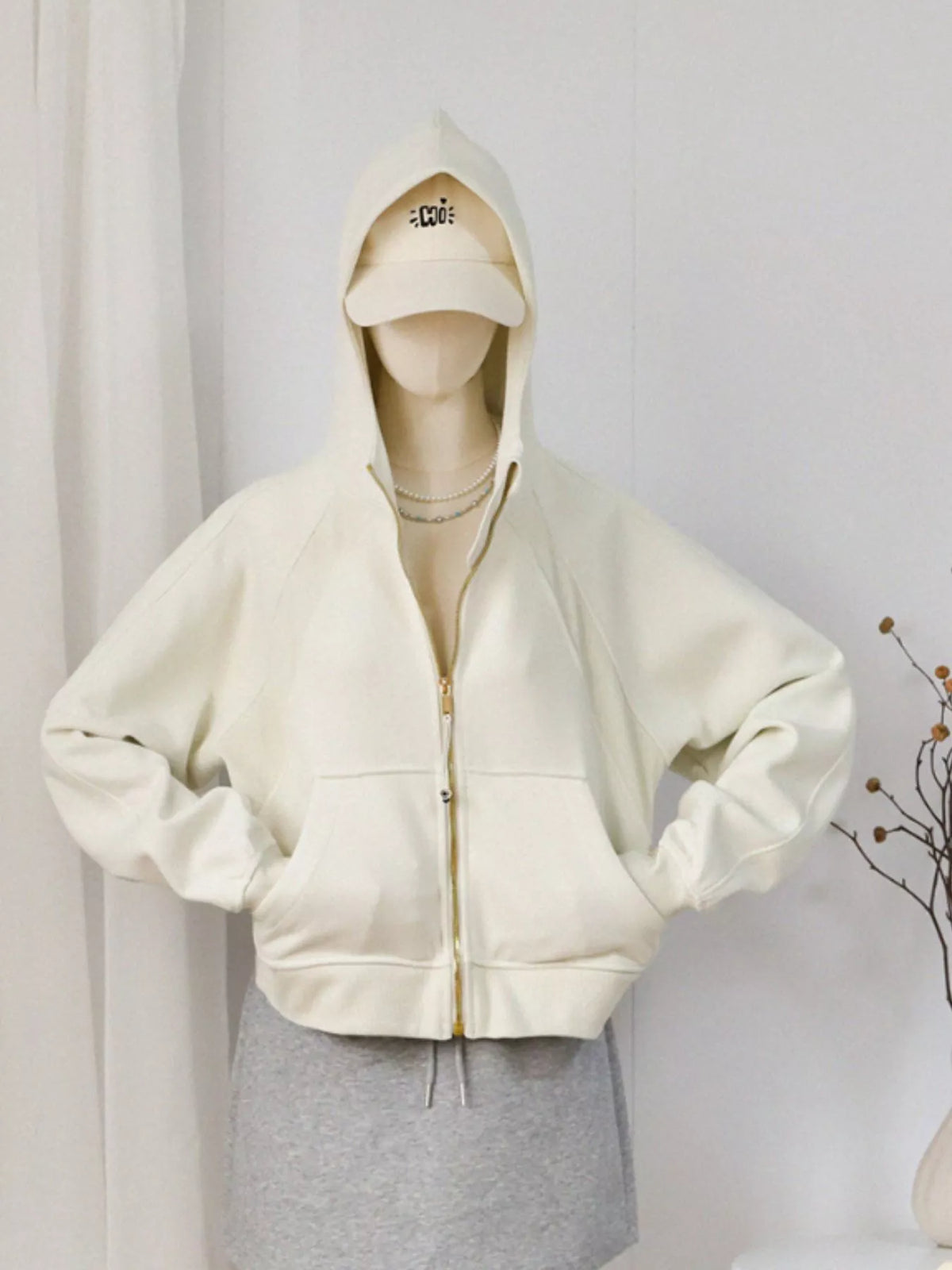 Women's Zip Up Raglan Sleeve Hoodie in cream — mannequin front view