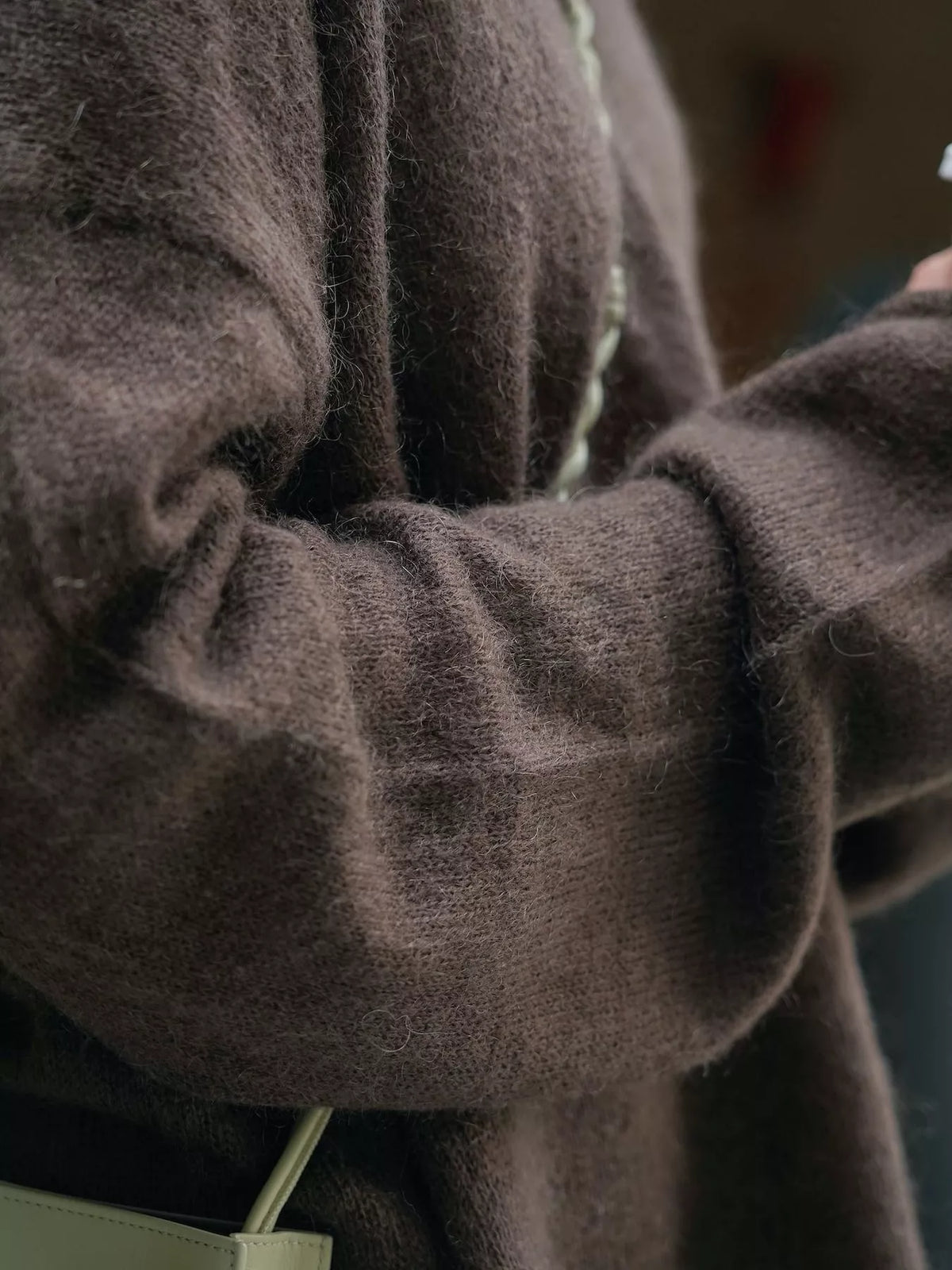 Brown round neck sweater, fuzzy knit texture and sleeve