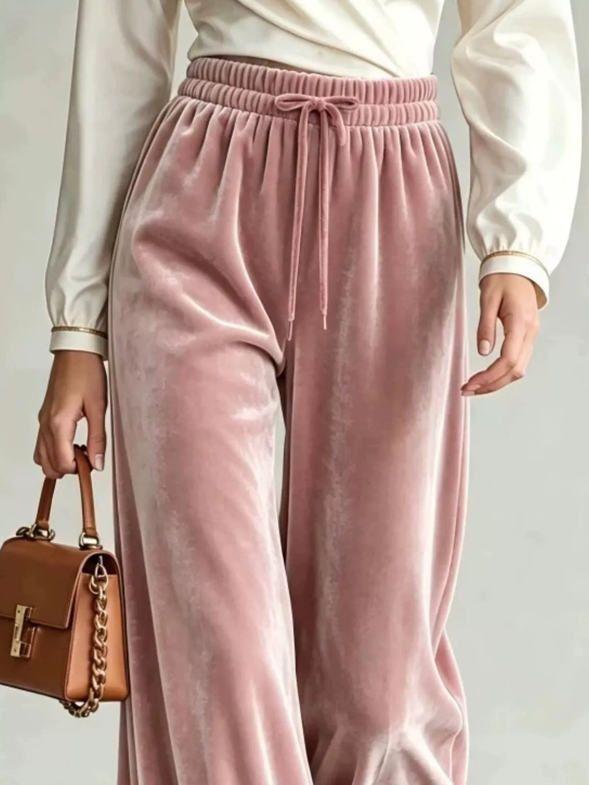 Pink wide-leg drawstring velvet pants, waistband detail