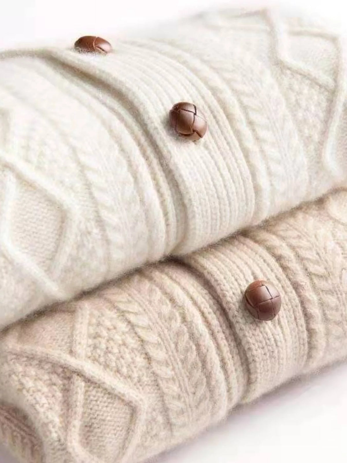 Beige cable-knit button-down cardigan, detail view