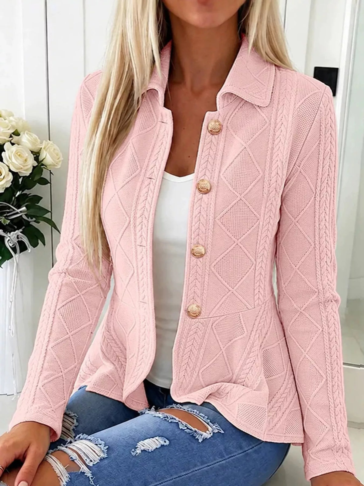 Pink cable-knit button-up cardigan — front view