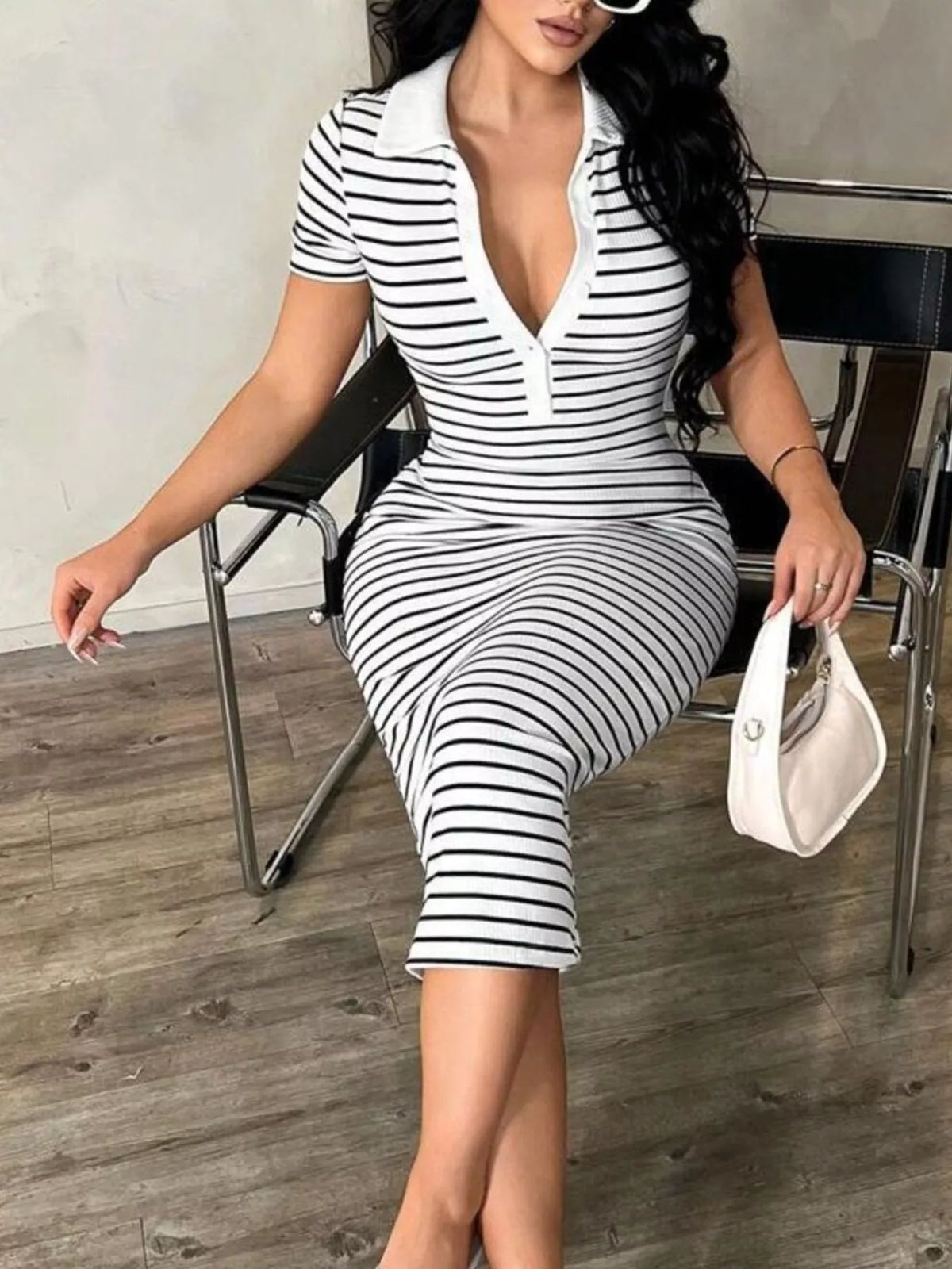 Striped Short Sleeve Bodycon Midi Dress in white and black, front while seated view