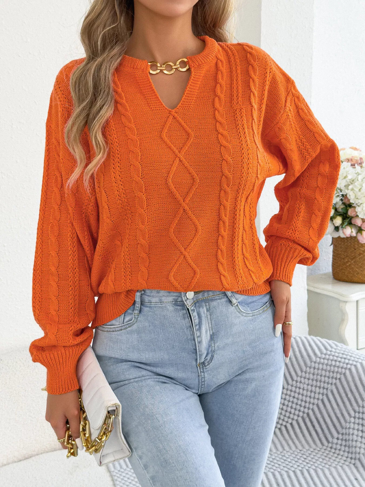 Orange cable knit notched sweater