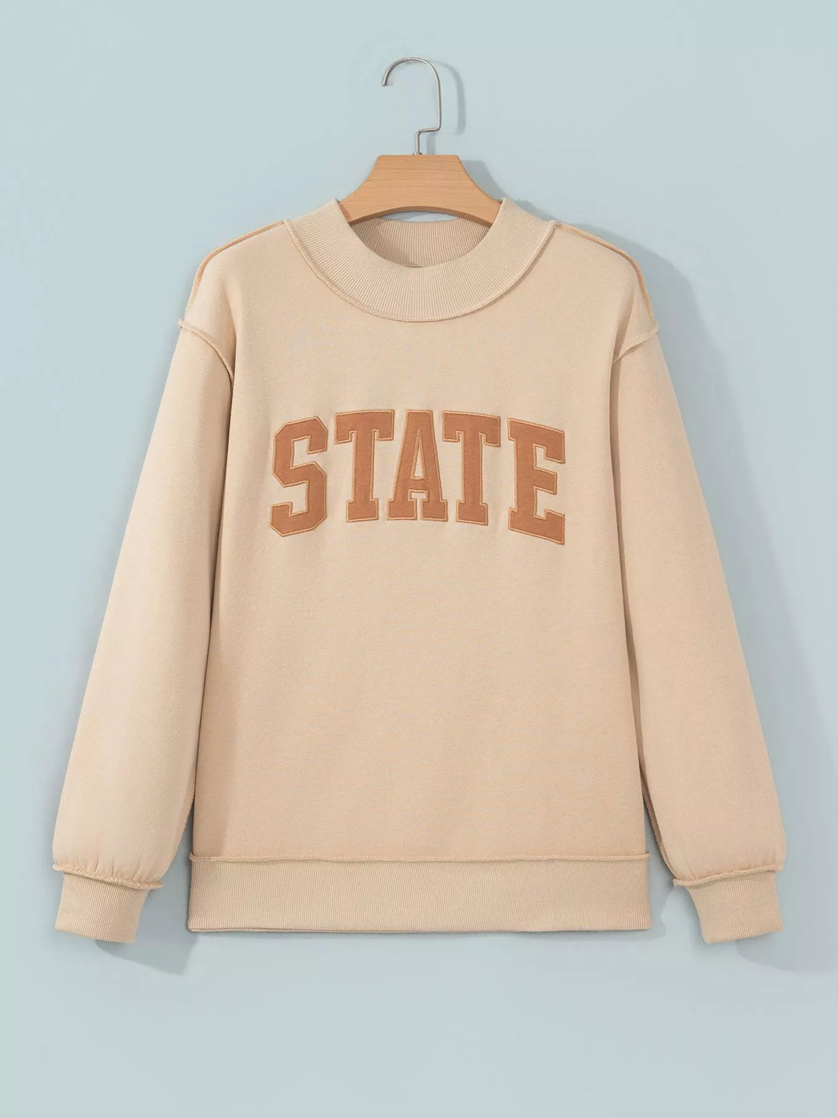 STATE Graphic Exposed Seam Mock Neck Sweatshirt — garment front